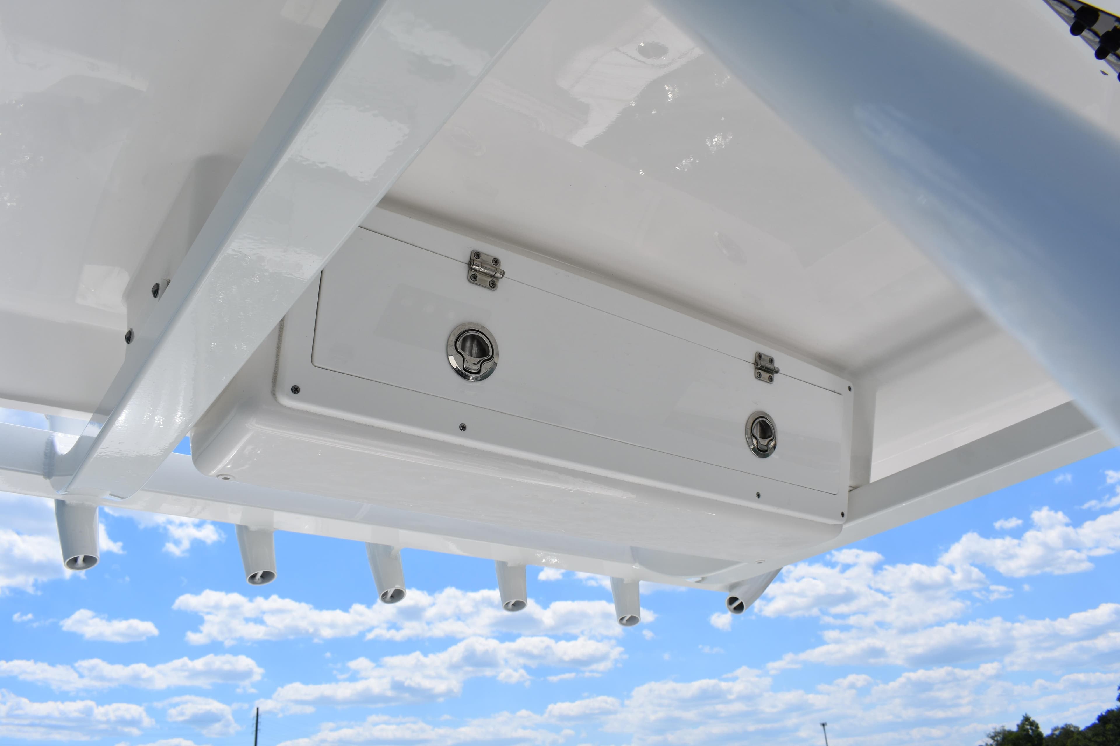 2026 Sea Fox 248 Commander boat storage compartment under clear blue sky.