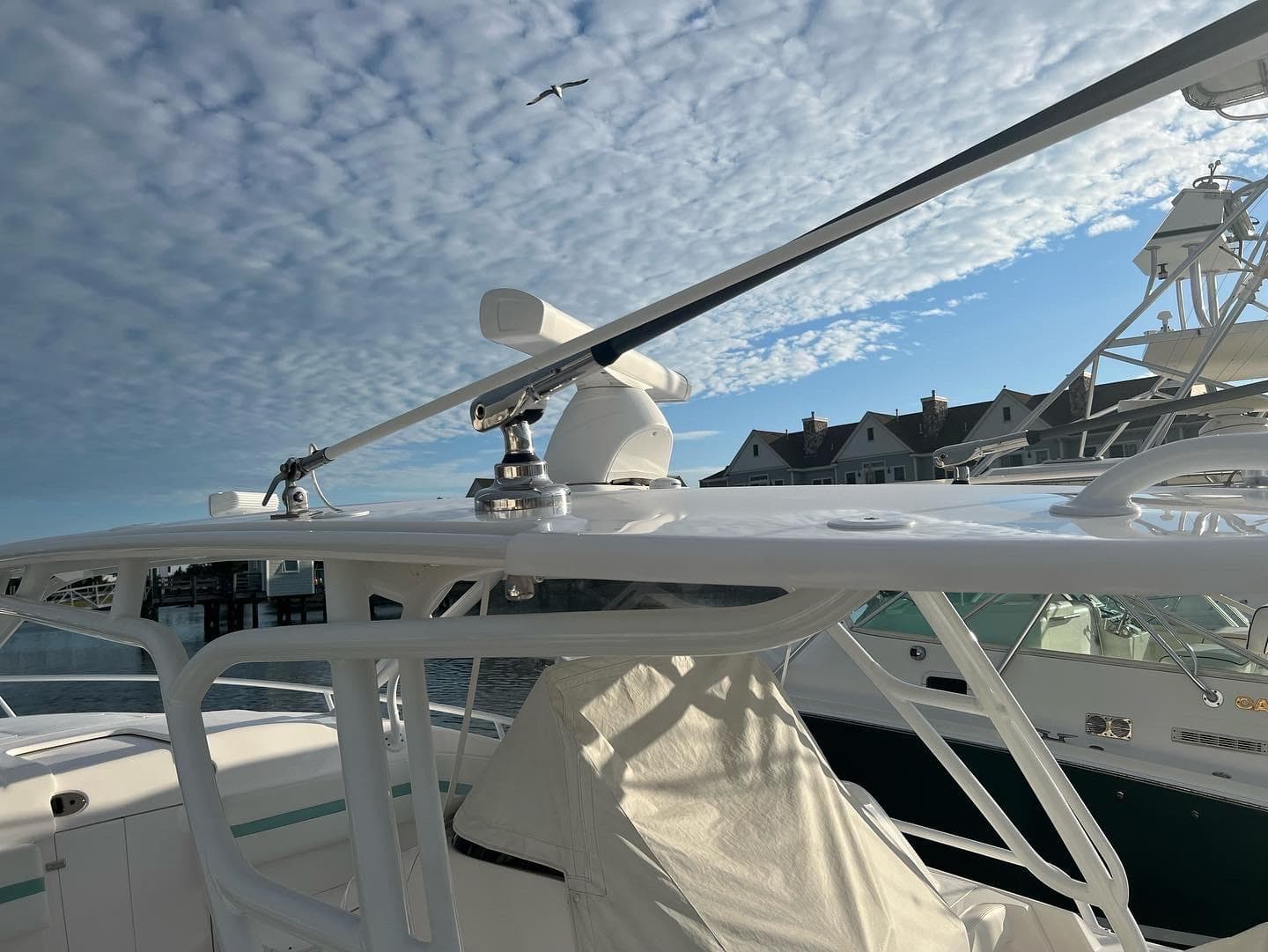 2018 Intrepid 375 Walkaround boat docked under a cloudy sky.