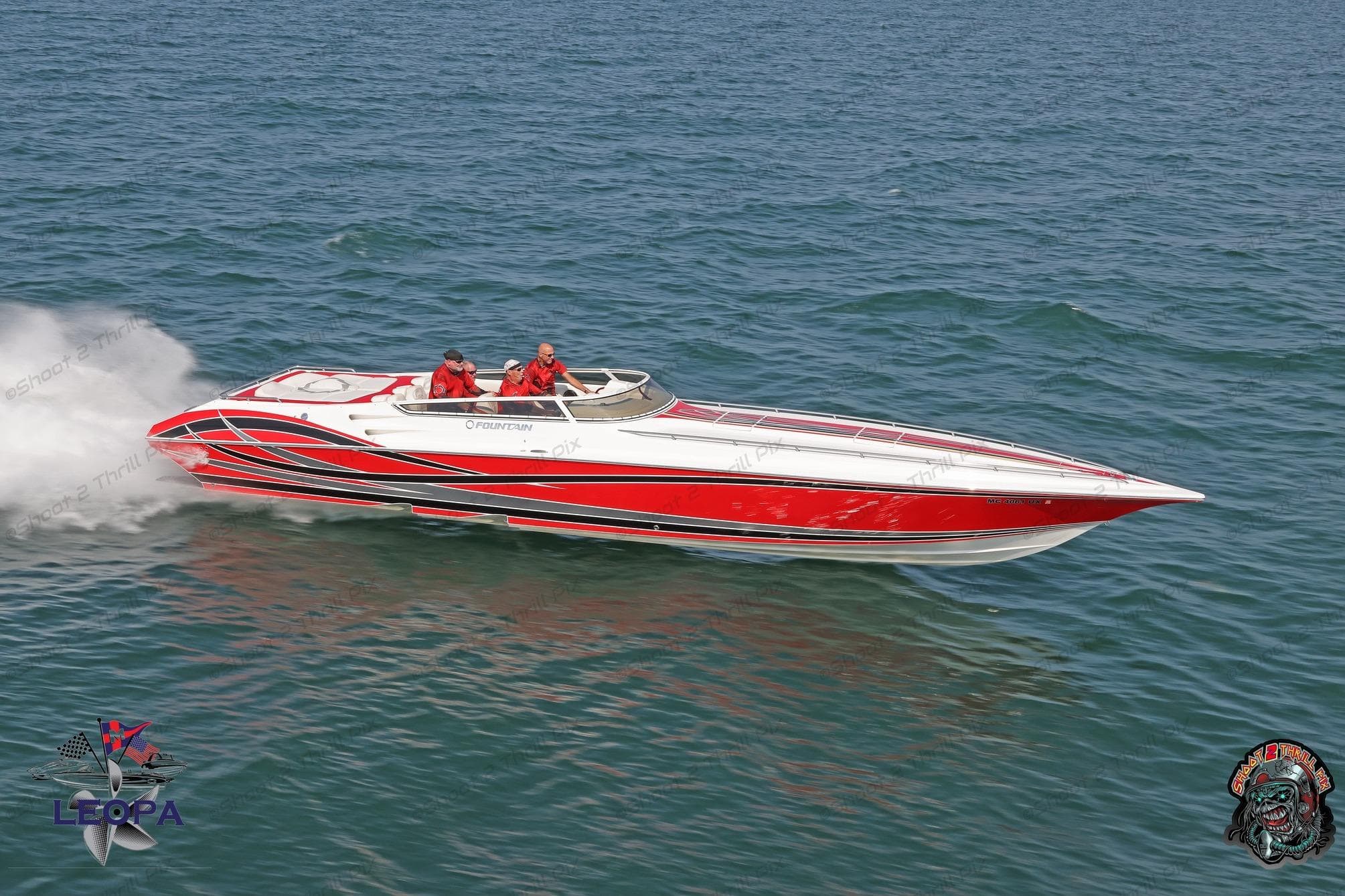 2007 Fountain 42 Lightning speedboat cruising on open water, featuring sleek red and white design.