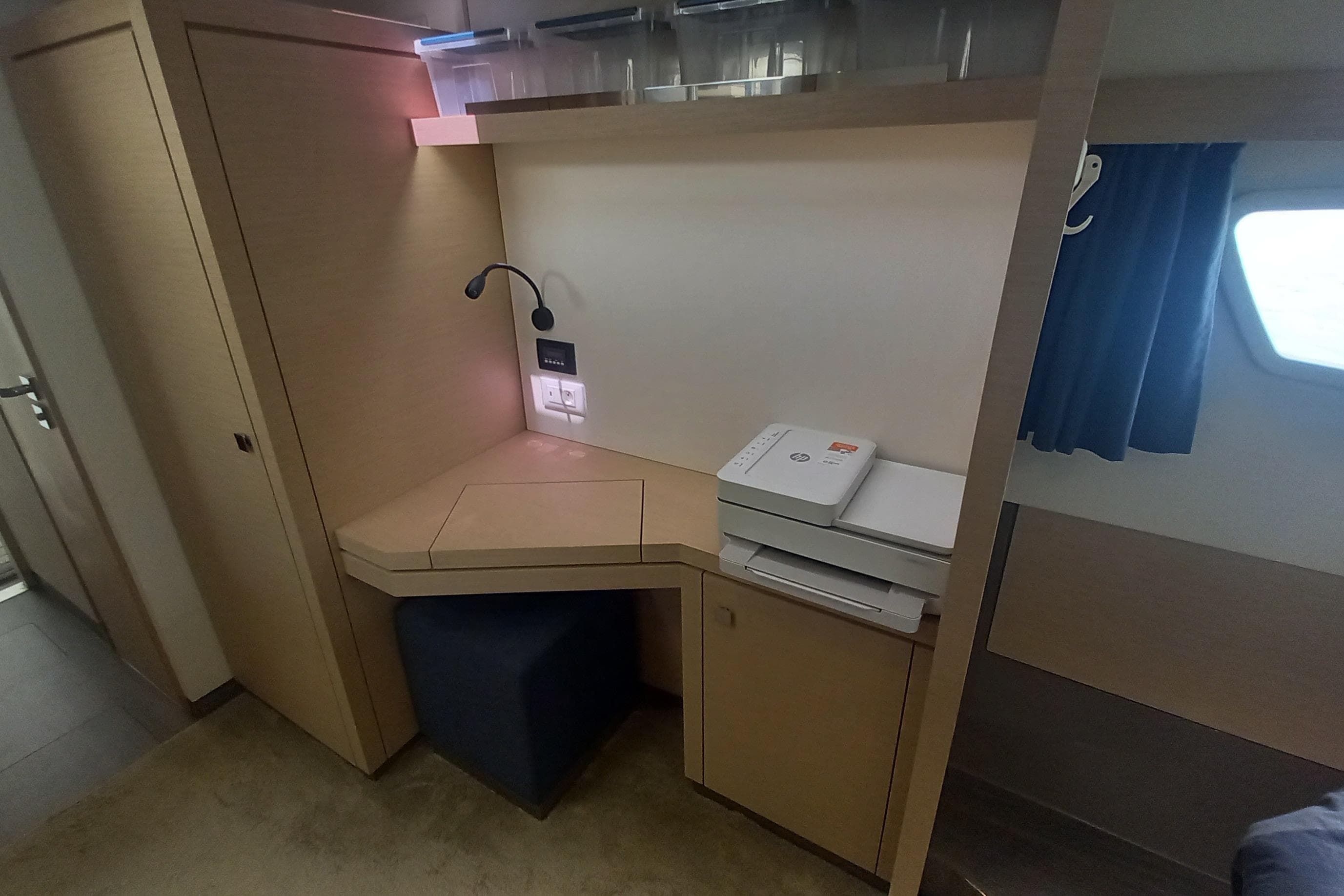 Interior of 2018 Fountaine Pajot Lucia 40 with desk, printer, and storage.