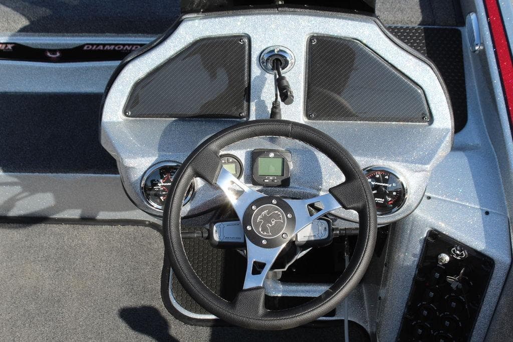 Steering console of 2026 Phoenix 921 Elite X boat with modern controls and gauges.