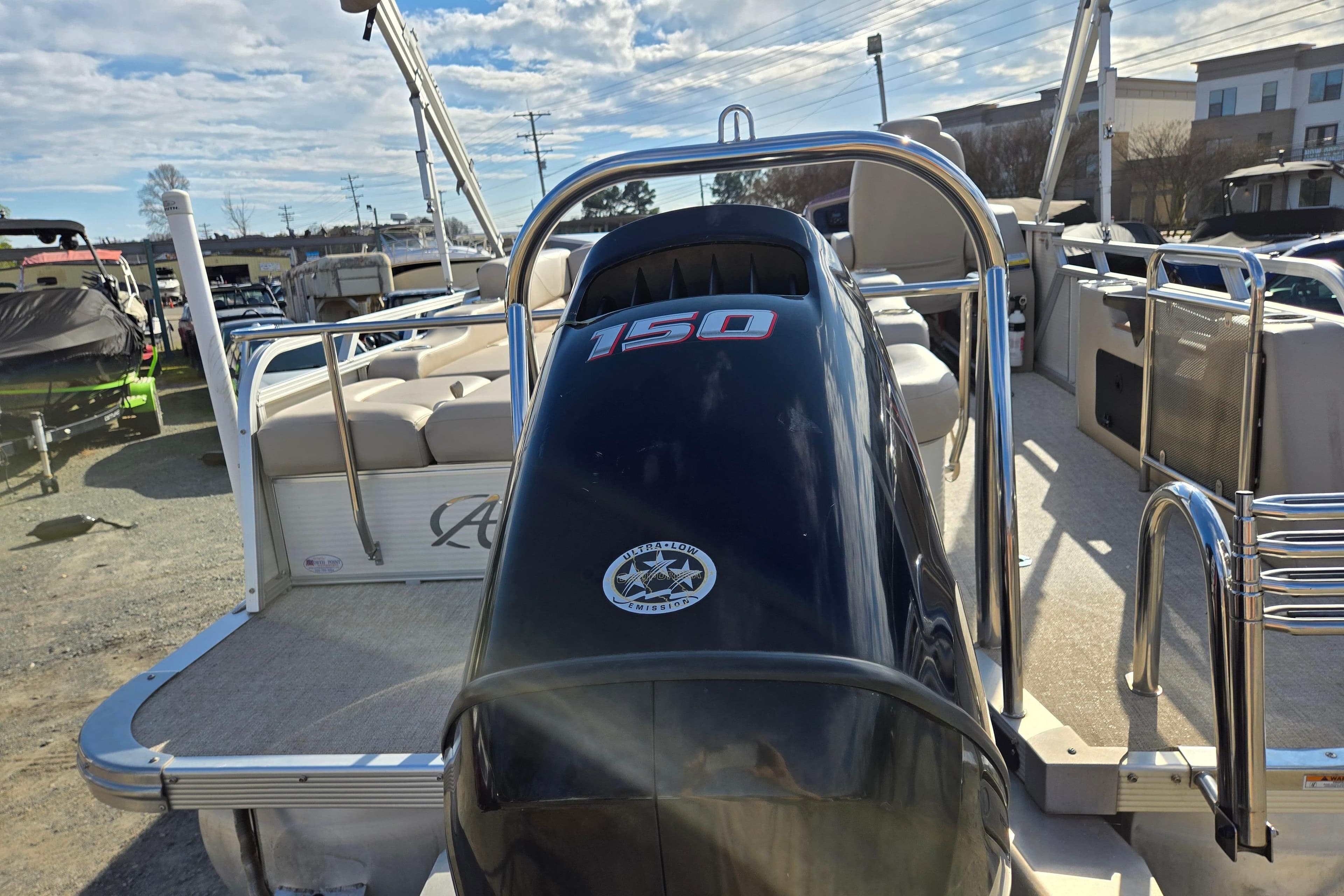 2020 Avalon LSZ VRB 24' pontoon boat with 150 HP engine, docked under blue sky.