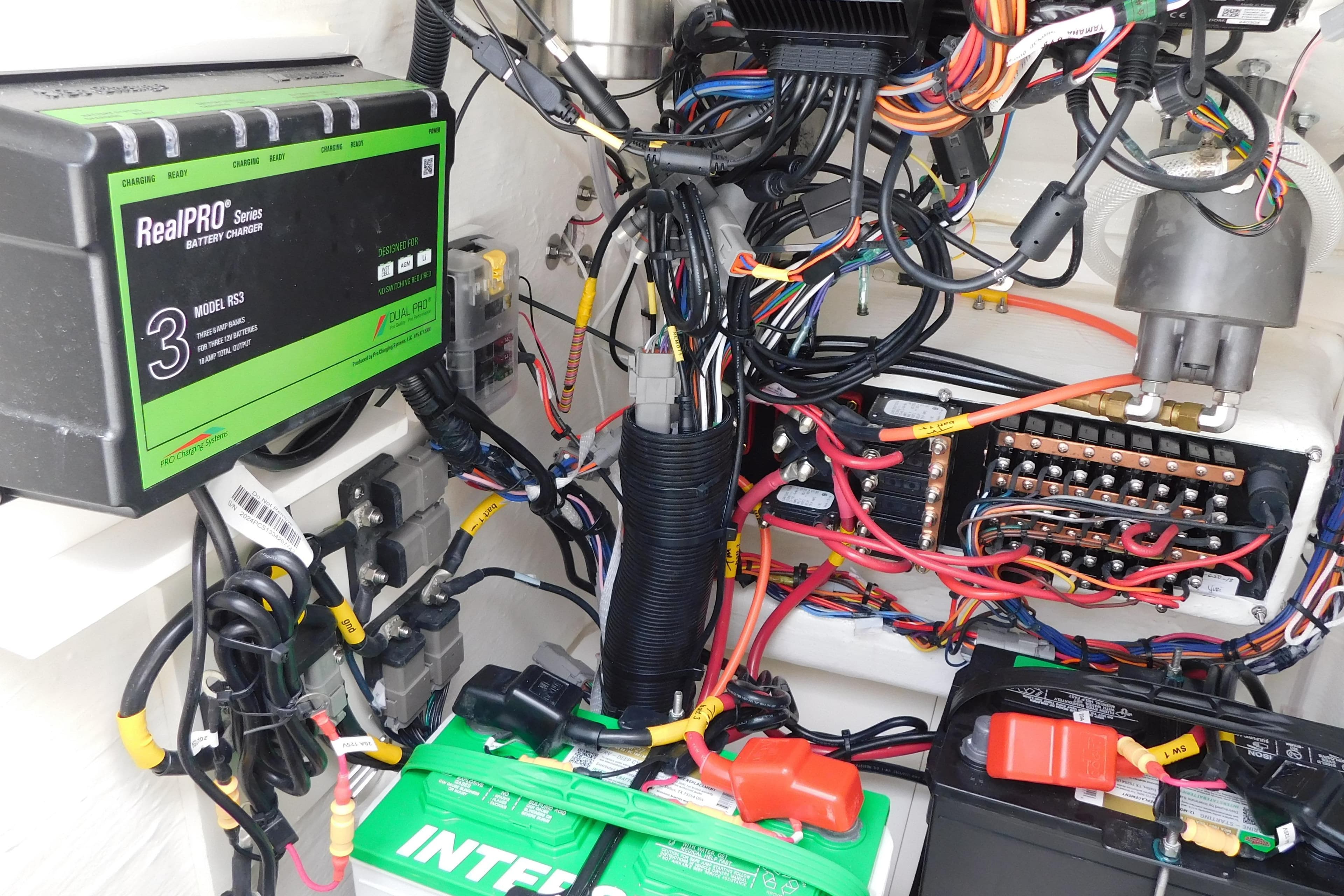 Electrical system of 2026 Pathfinder 2200 TRS with RealPRO battery charger and wiring.