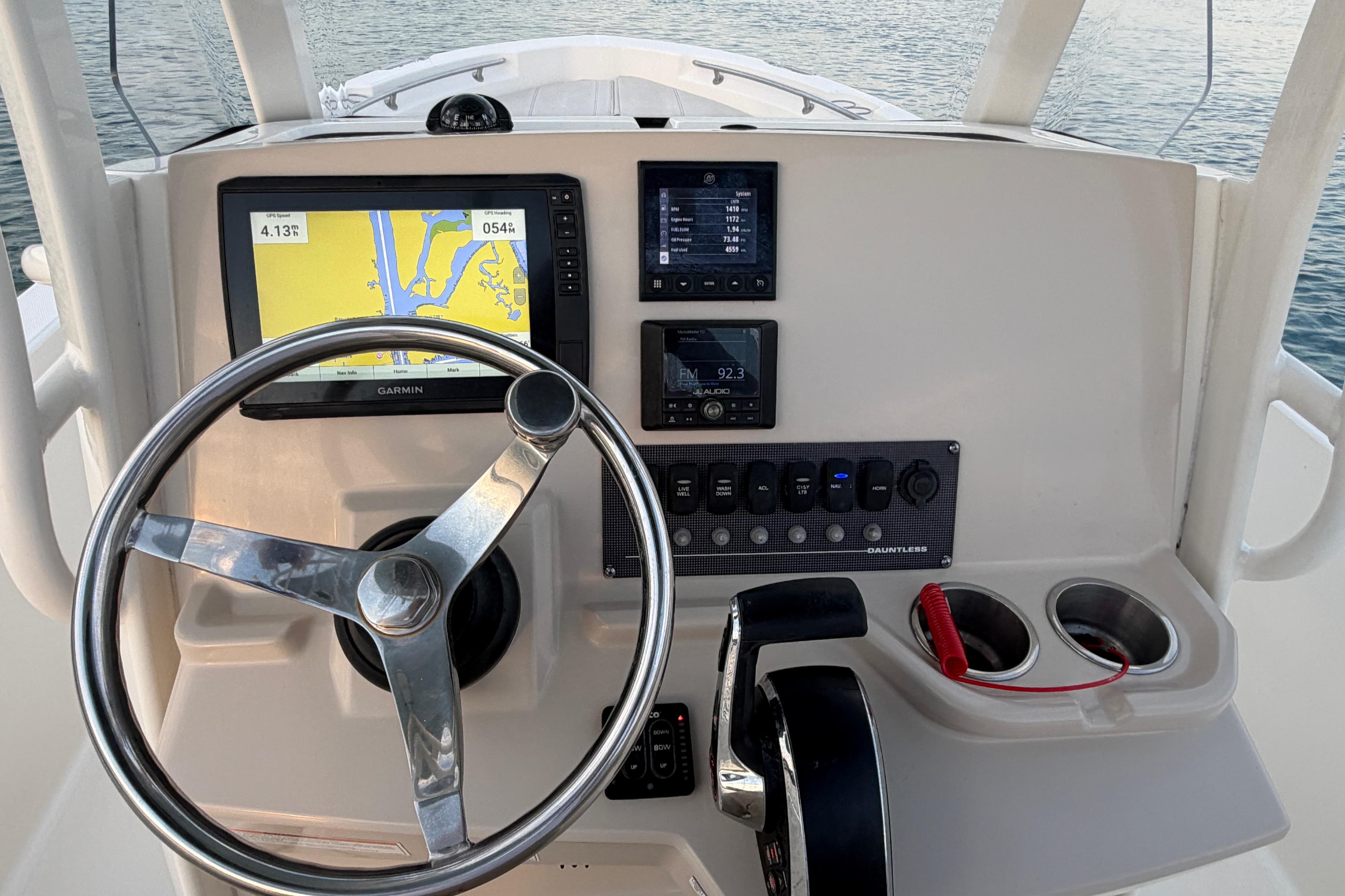 2023 Boston Whaler 220 Dauntless helm with Garmin navigation and control panel.