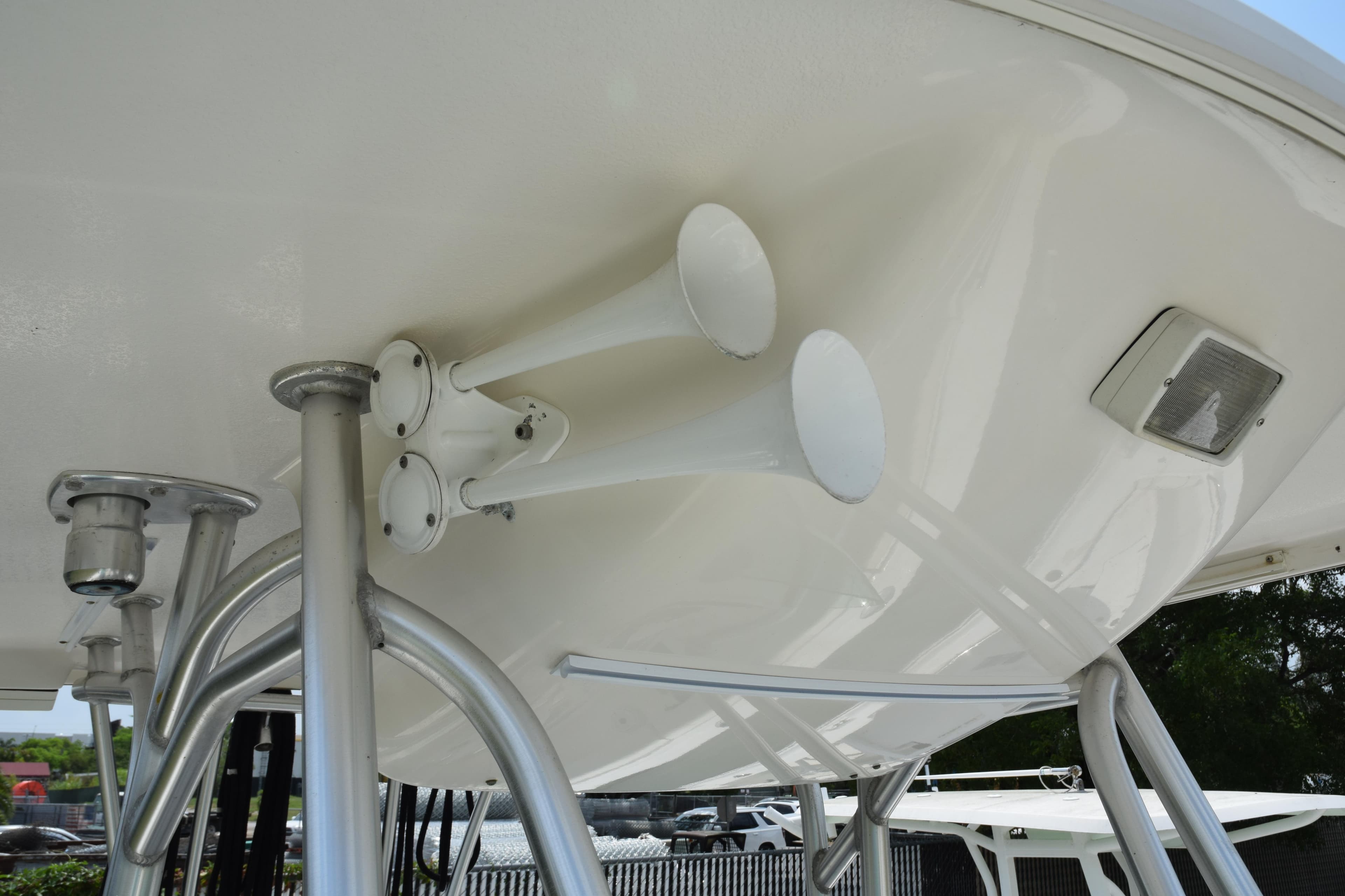 2006 Robalo R260 Center Console boat with dual horns and T-top.