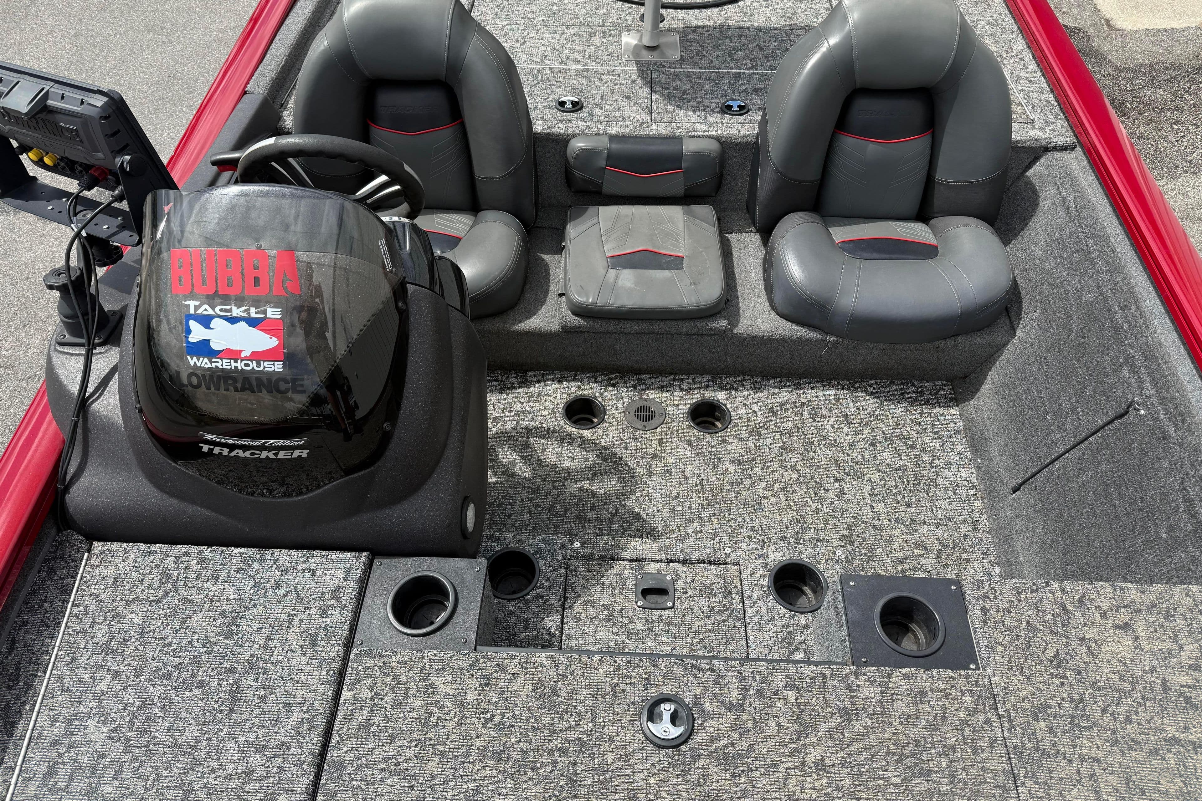 Interior of 2023 Pro Team 195 boat with steering console and seating.