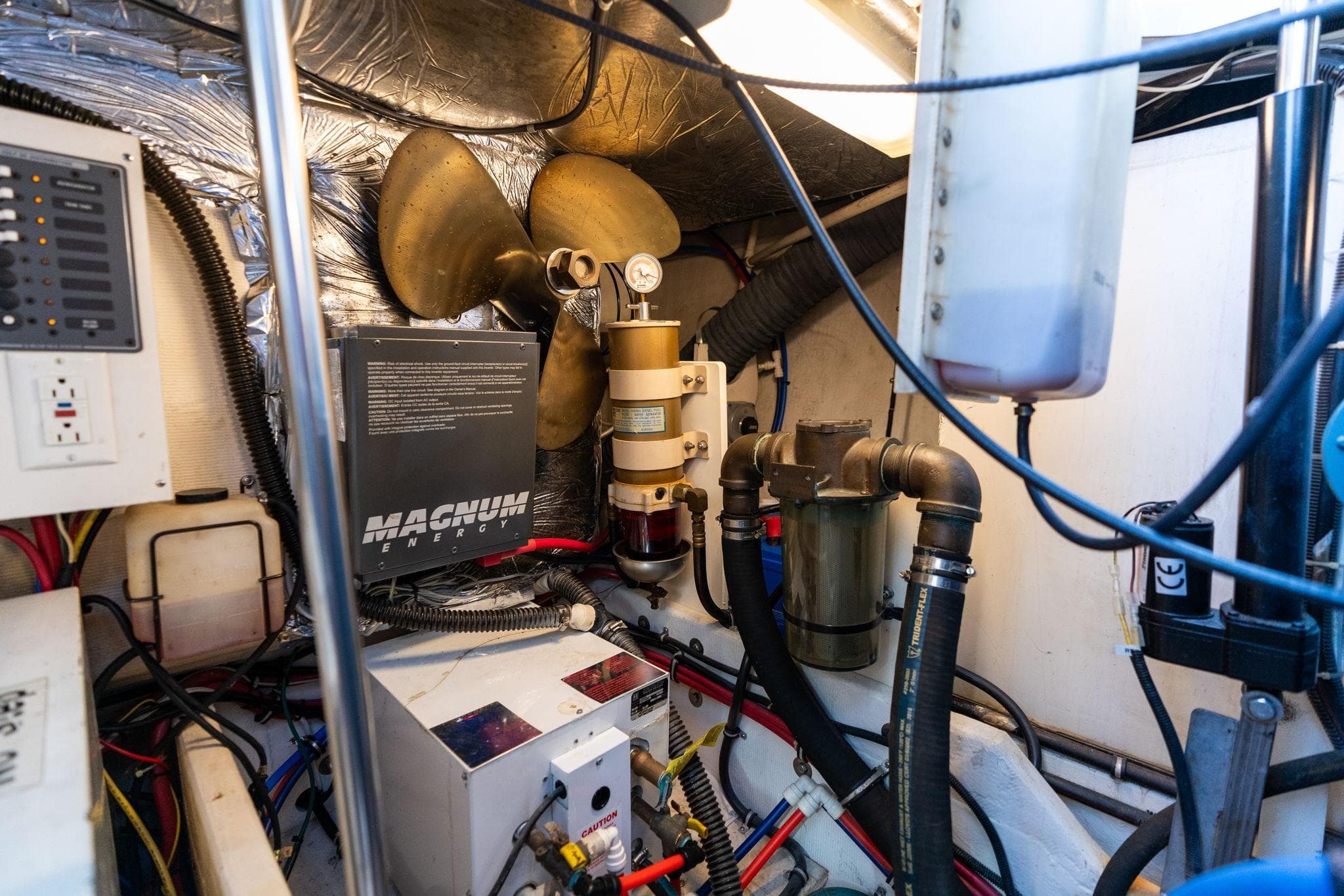 Engine room of a 1998 Tiara Yachts 3500 Express with Magnum Energy equipment.