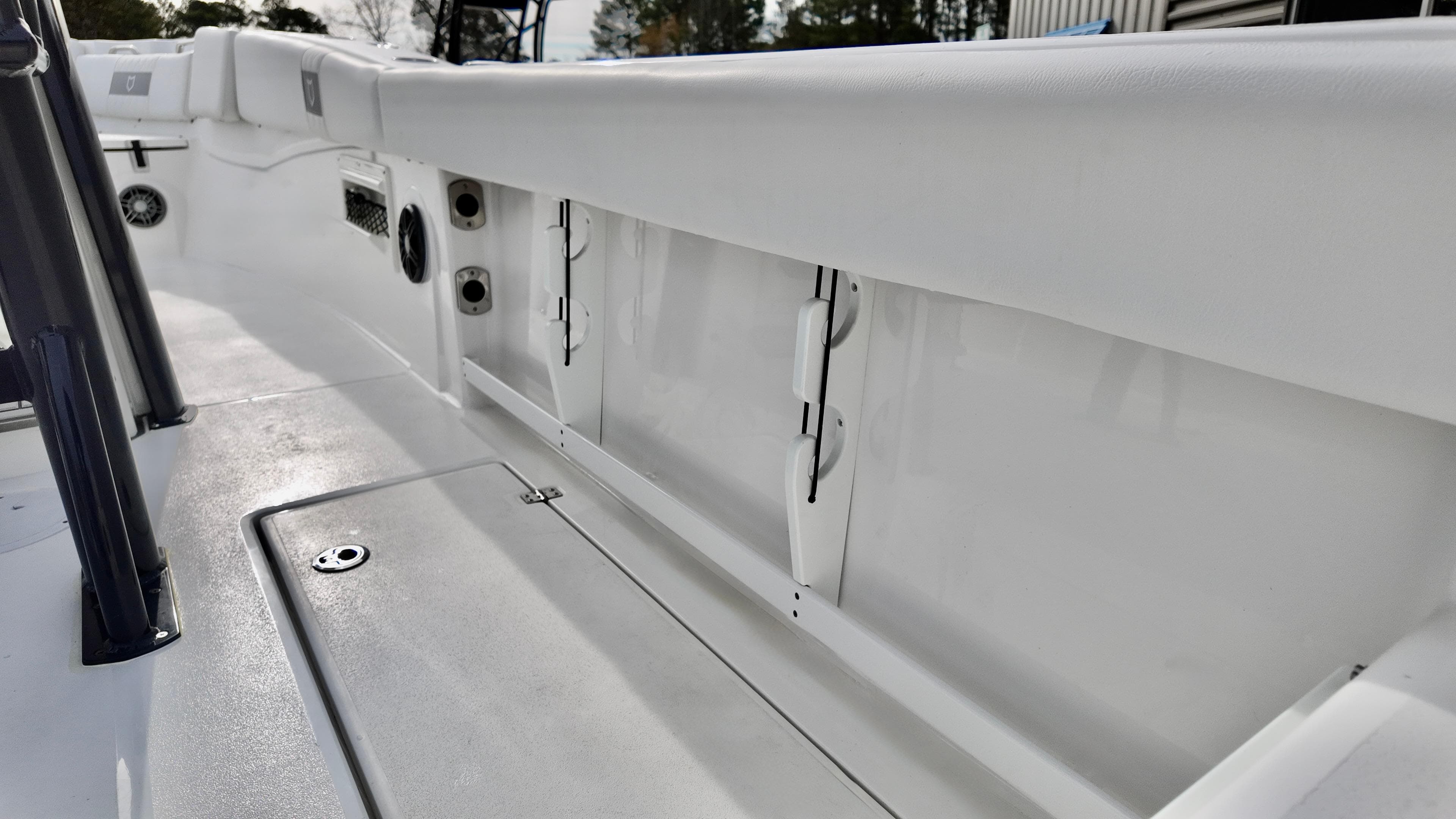 2025 Sea Fox 268 Commander boat interior, showcasing sleek white design and storage compartments.