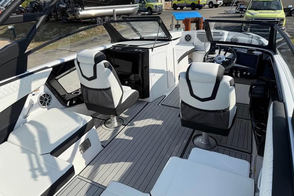 2026 Yamaha Boats 222S interior with modern seating and sleek dashboard design.