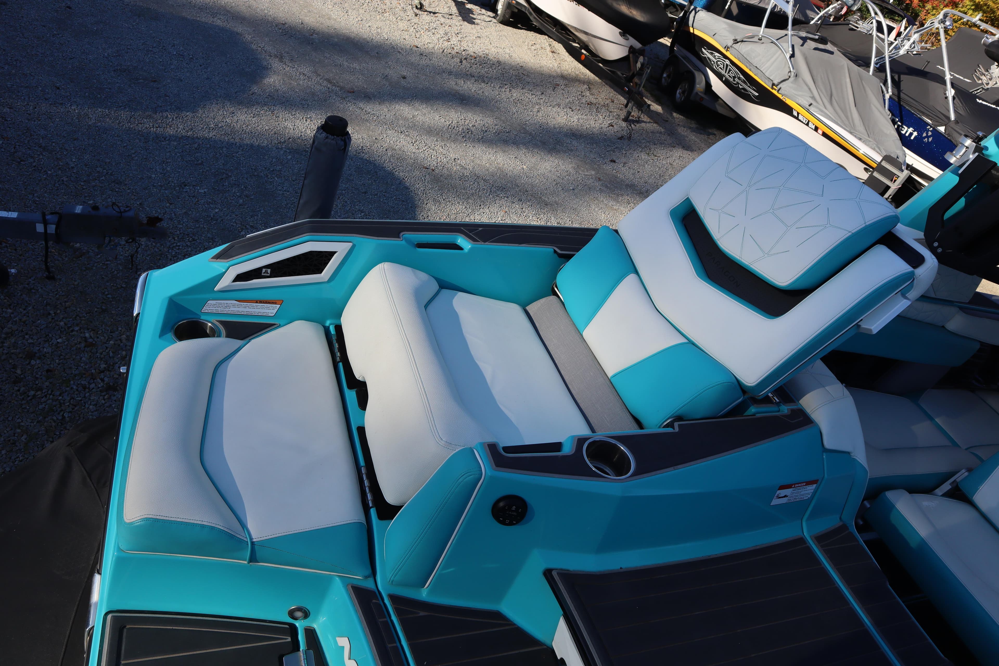 2021 Nautique Super Air Nautique G23 Paragon boat interior with turquoise and white seating.