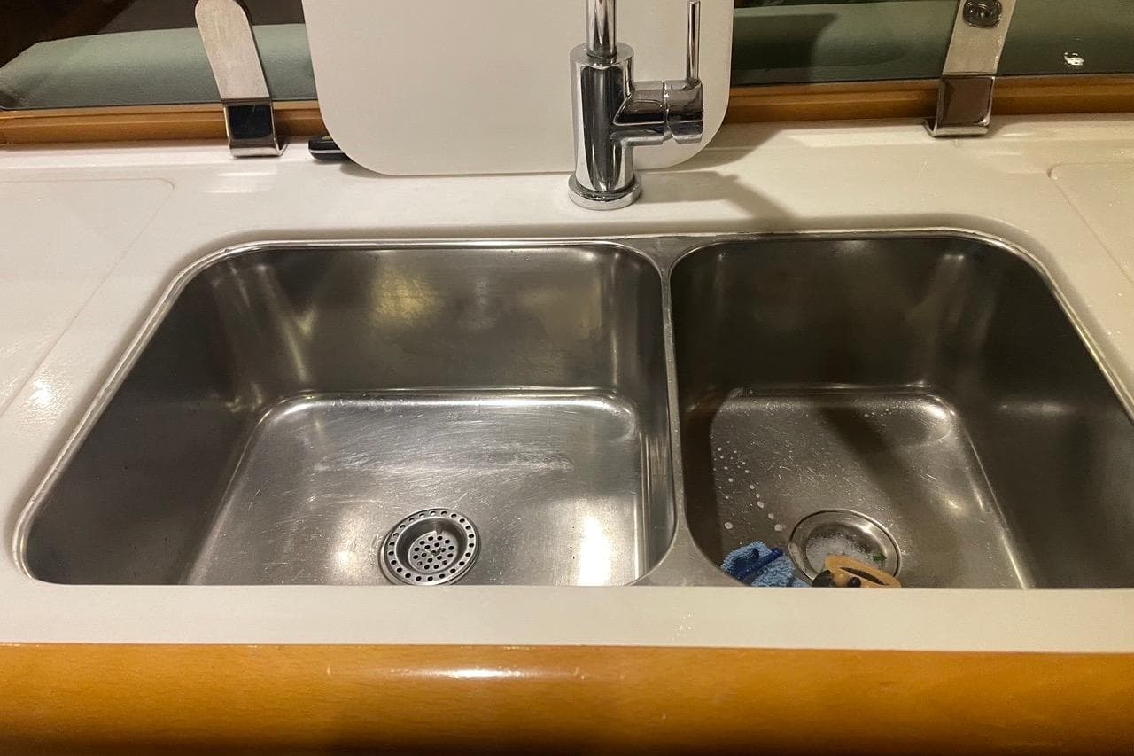 Stainless steel double sink in Jeanneau Sun Odyssey 50 DS yacht, 2015 model.