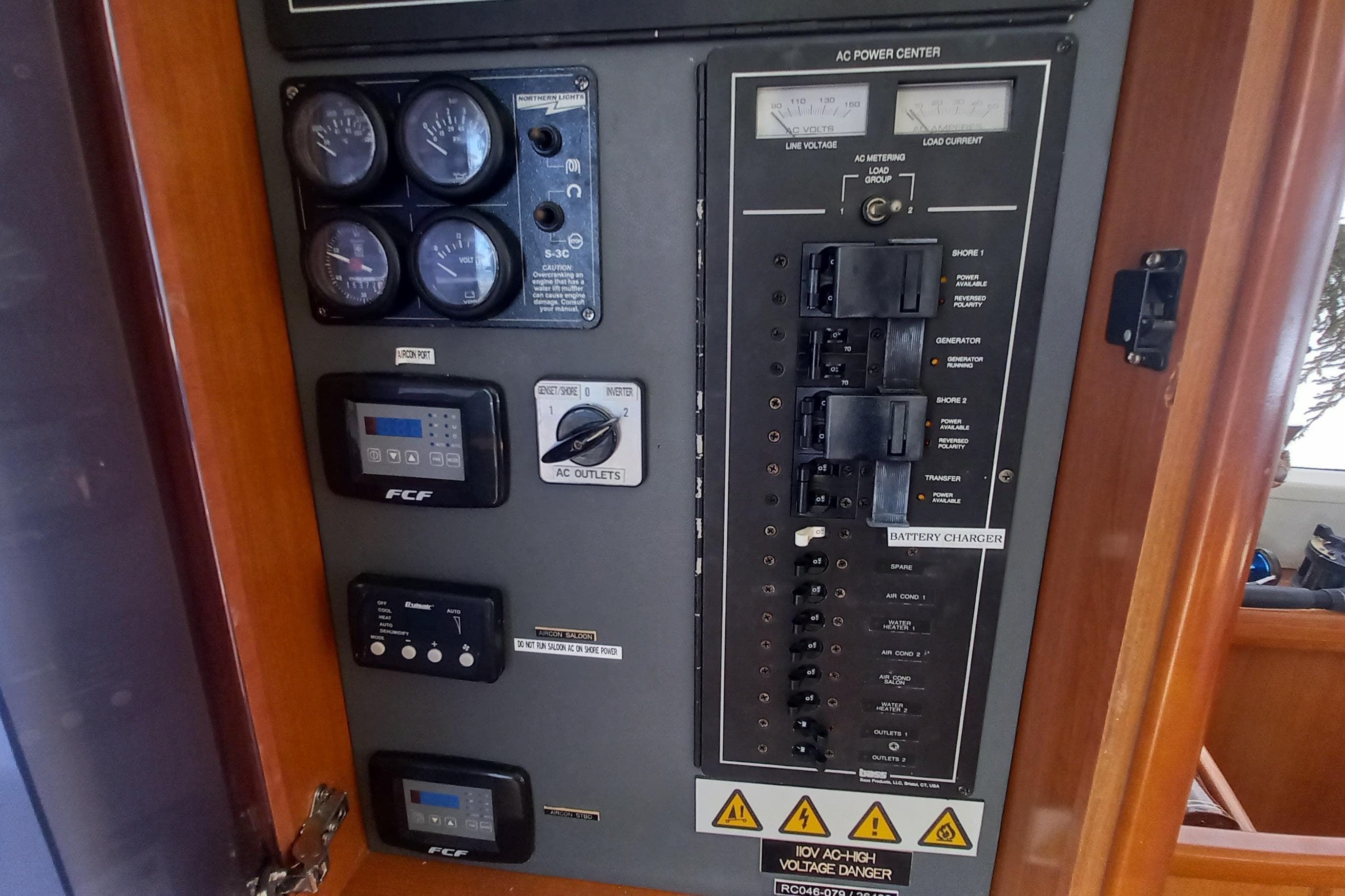 Electrical control panel on a 2010 Leopard 46 yacht, featuring gauges and switches.