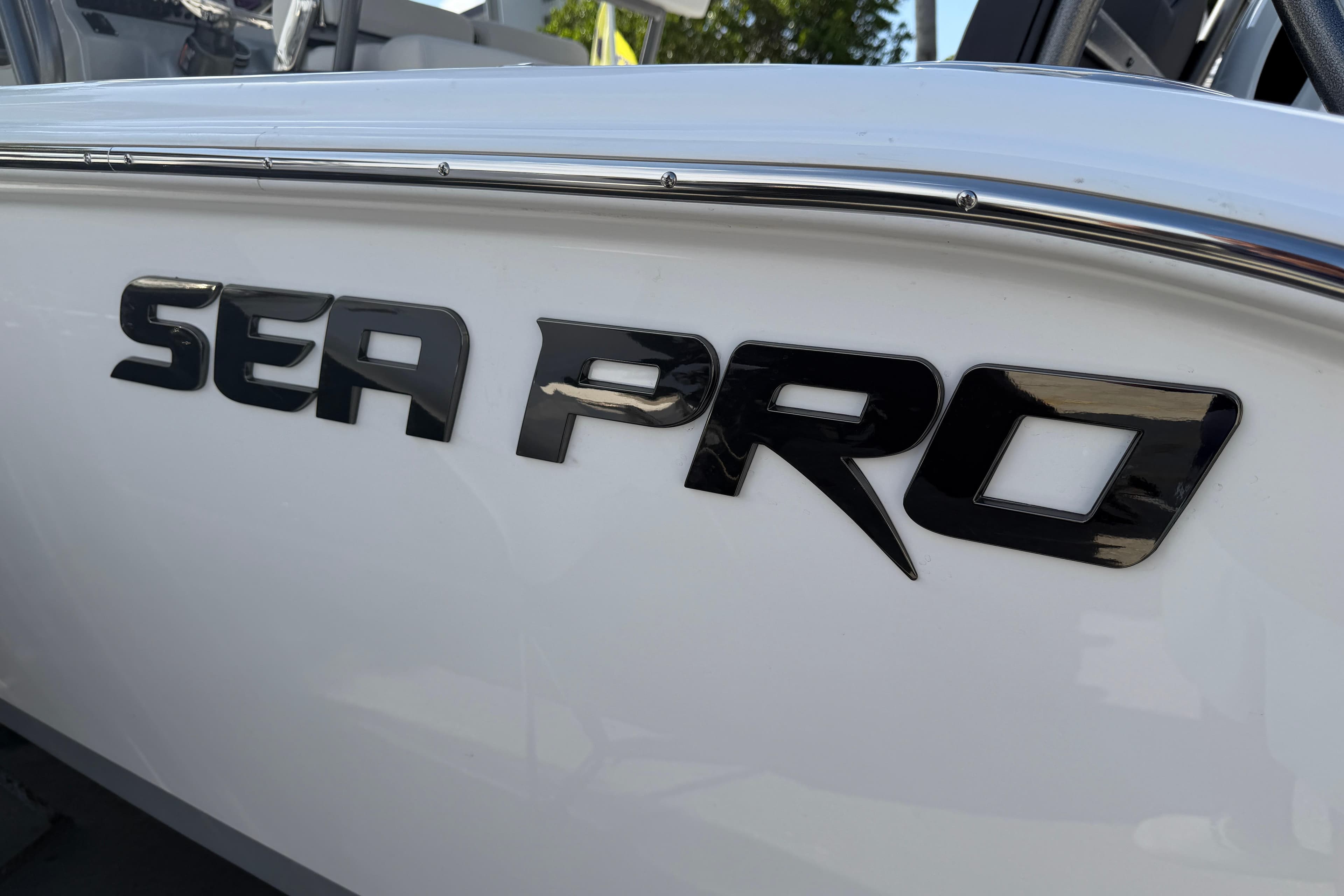 2026 Sea Pro 225FLX Sandbar boat logo on sleek white hull.