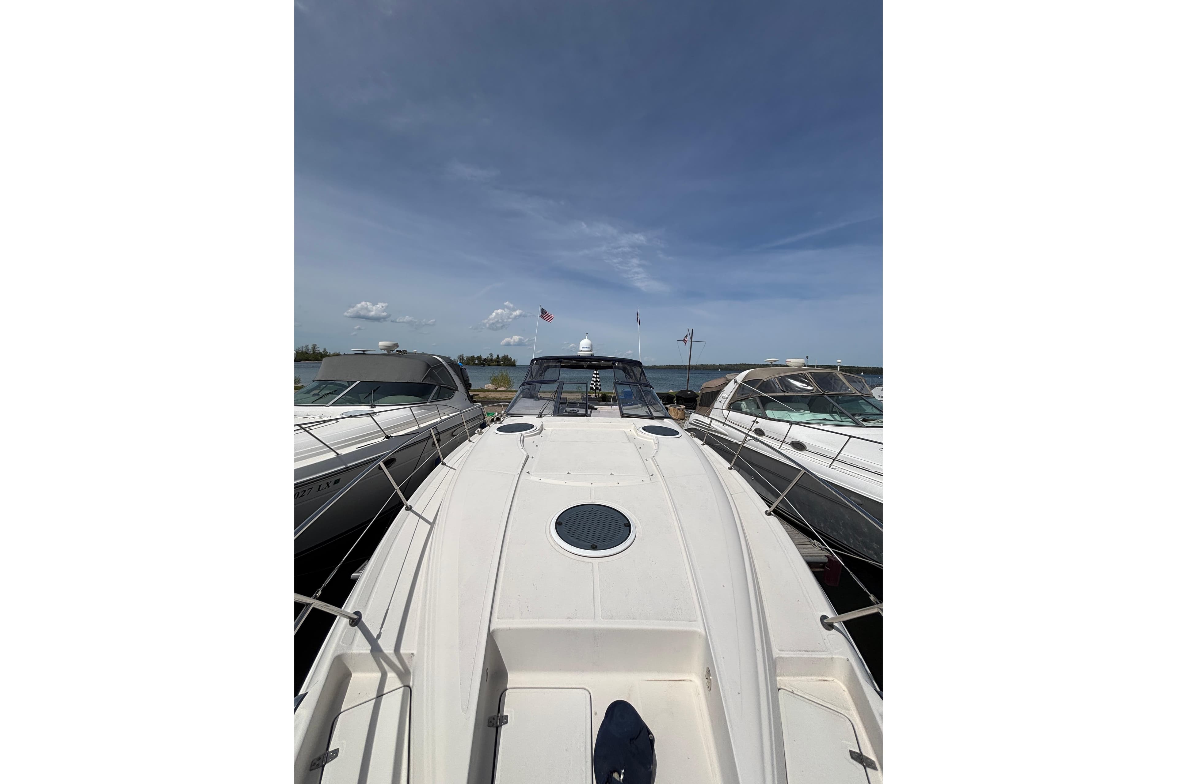2000 Regal Commodore 4160 yacht docked under clear blue sky.