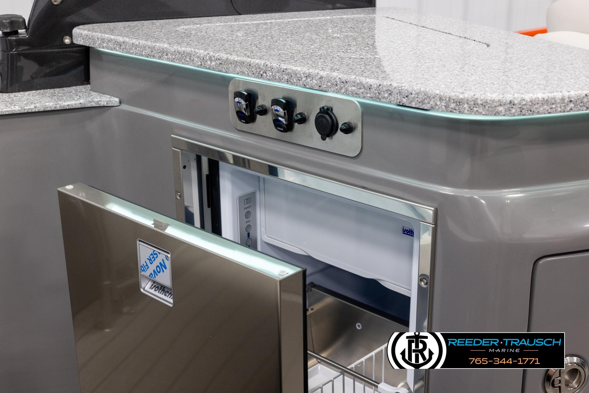 2024 Avalon 2785 Excalibur EL boat interior with granite countertop and built-in refrigerator.