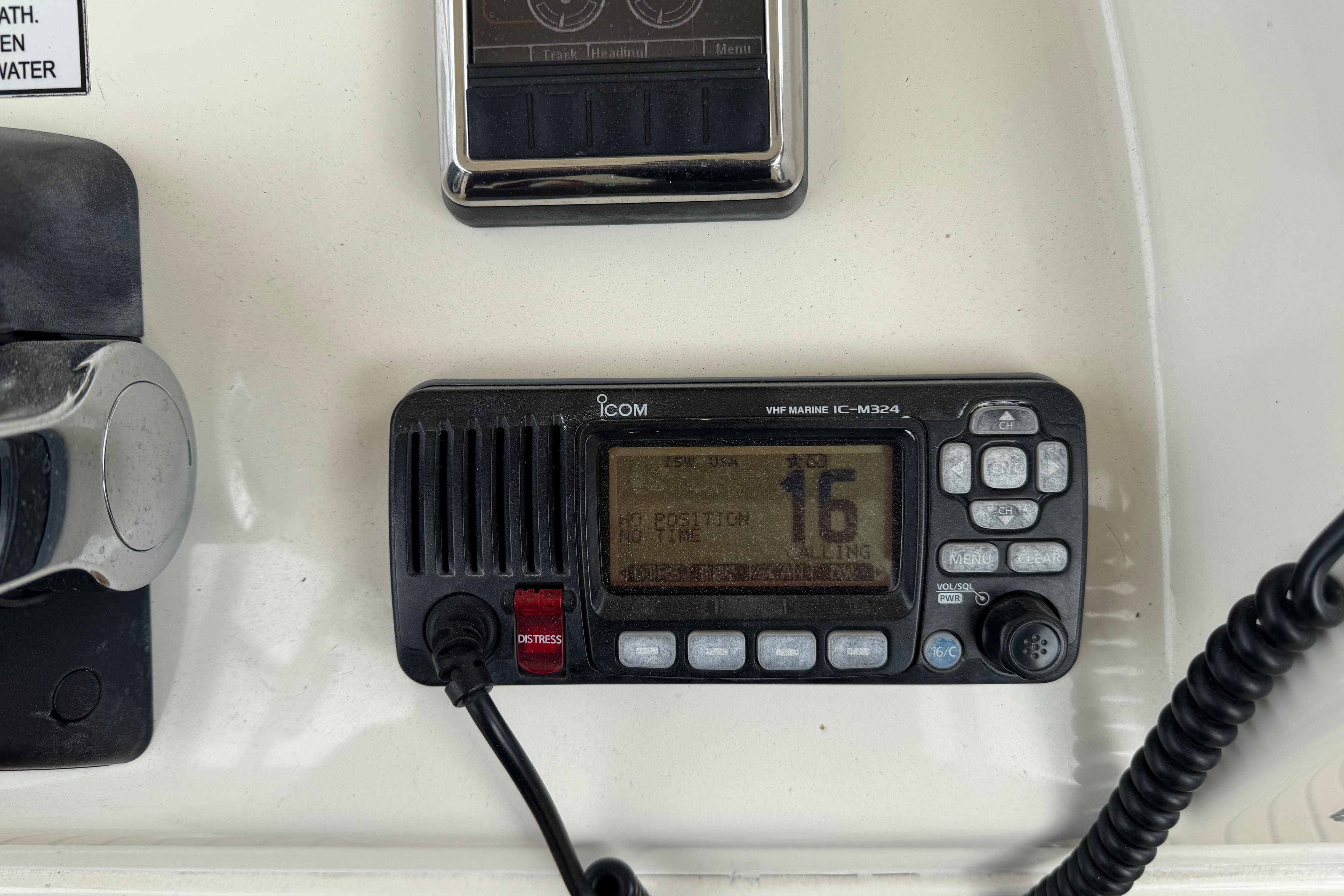 VHF marine radio on 2015 Cobia 344 Center Console boat dashboard.