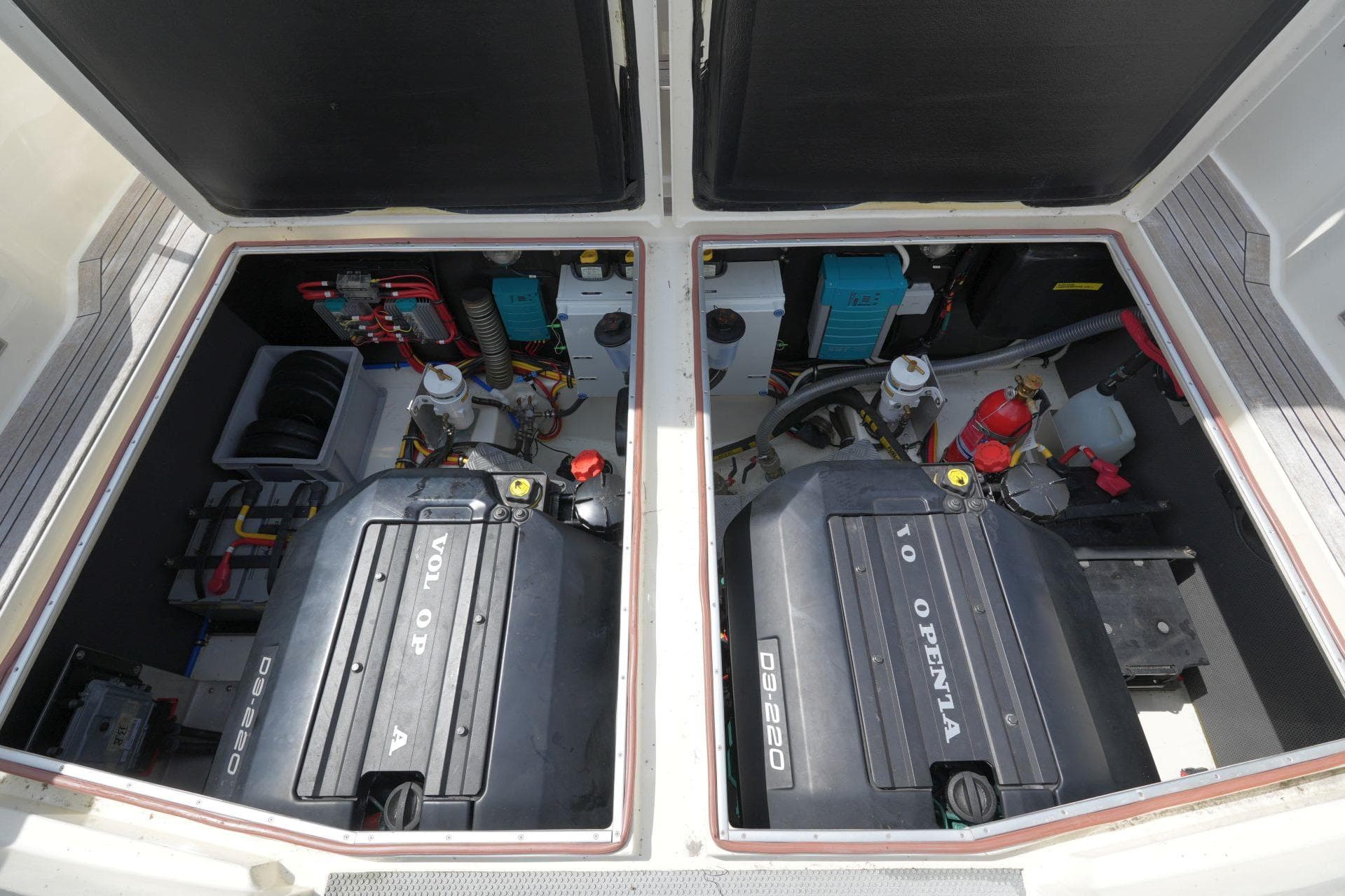 Engine compartment of 2011 Botnia Targa 27.1 with Volvo Penta engines and equipment.