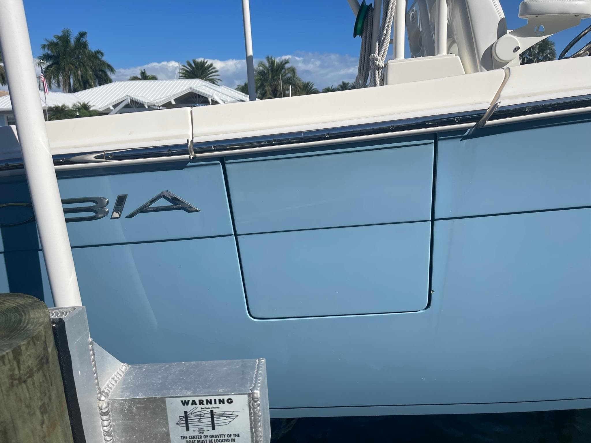 Cobia 301 Center Console boat, 2020 model, docked at marina.