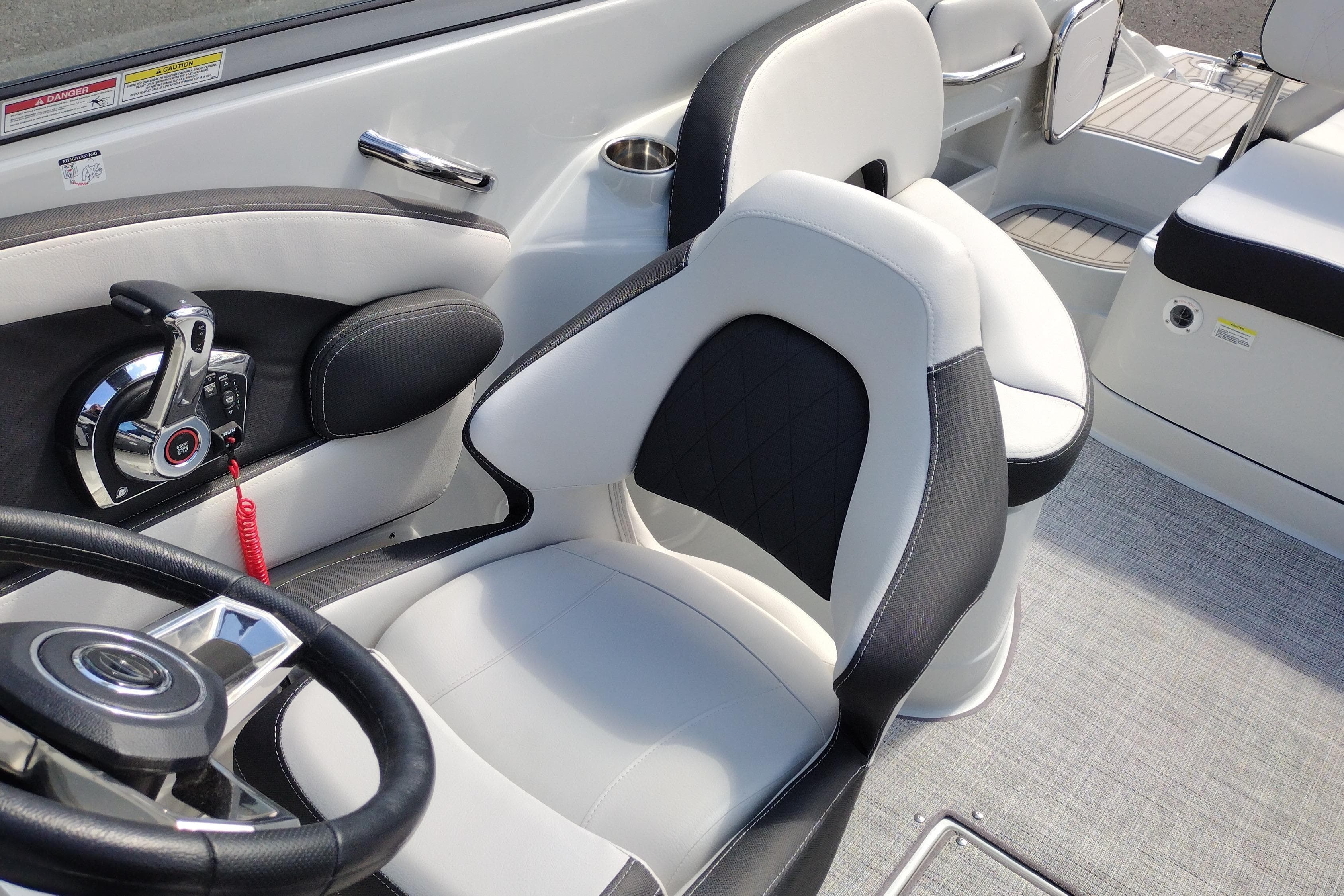 Interior of 2026 Crownline Eclipse E255 boat with modern steering and seating.