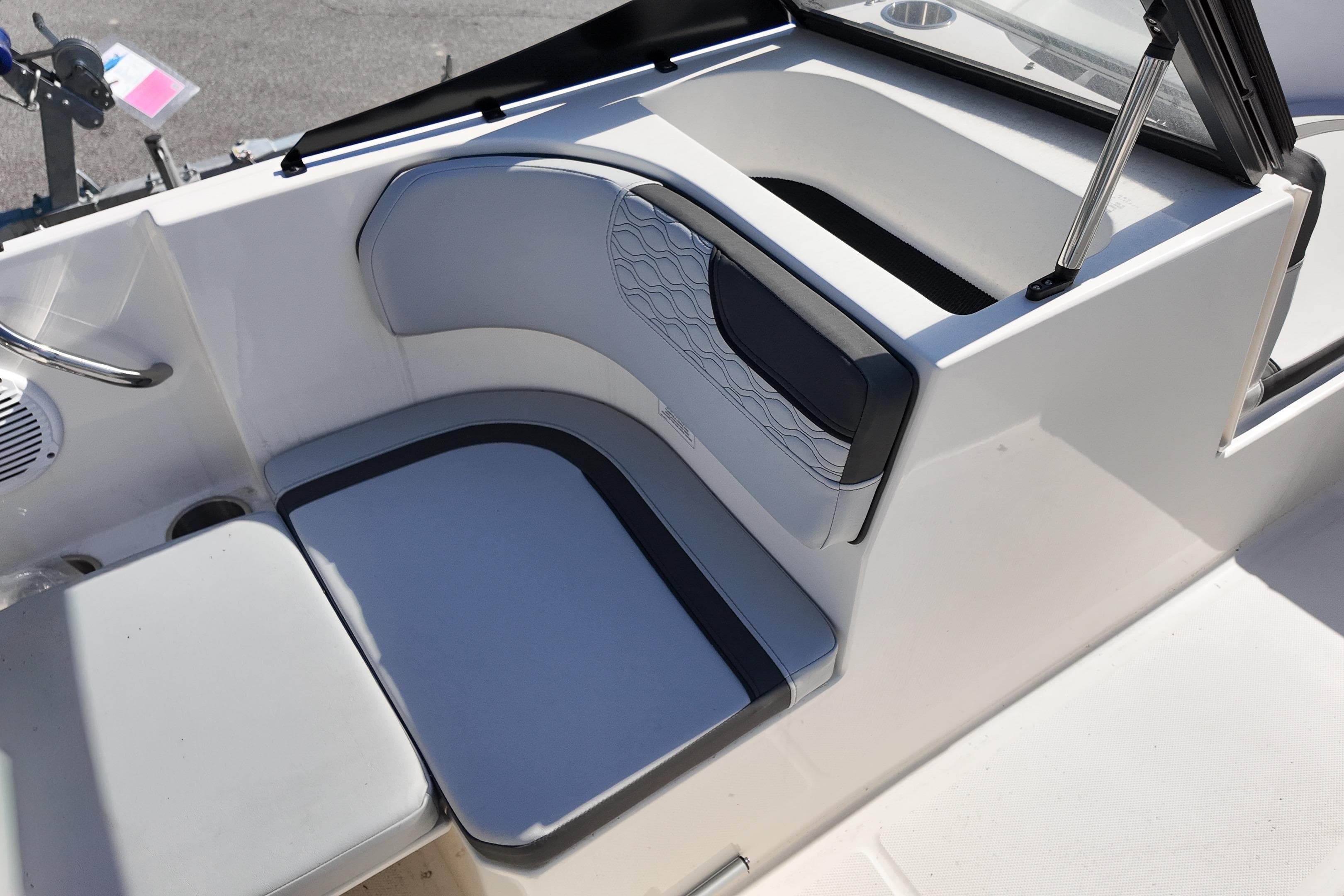 2026 Bayliner Element M17 boat interior seating with modern design and storage compartment.