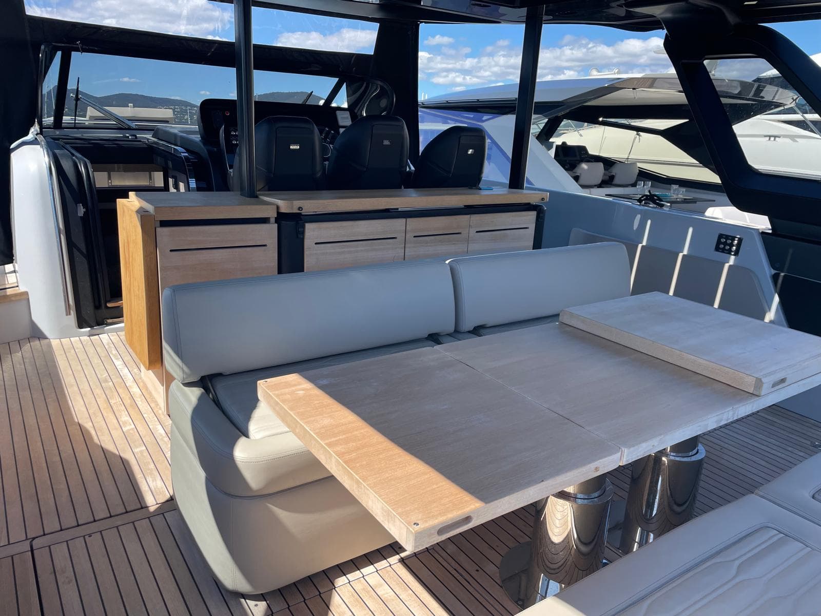 2023 Cranchi A46 Luxury Tender interior with seating and table, showcasing modern design.