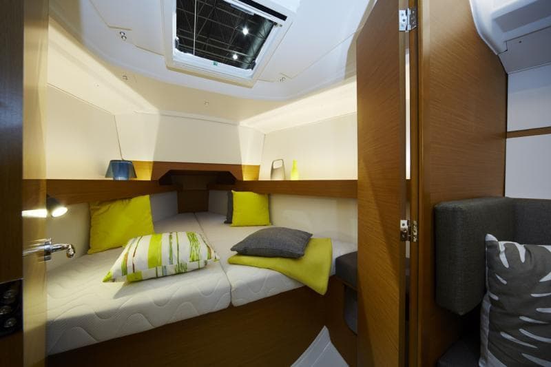 Manufacturer Provided Image: 2019 Jeanneau Sun Odyssey 349 cabin interior with cozy bedding and modern design.