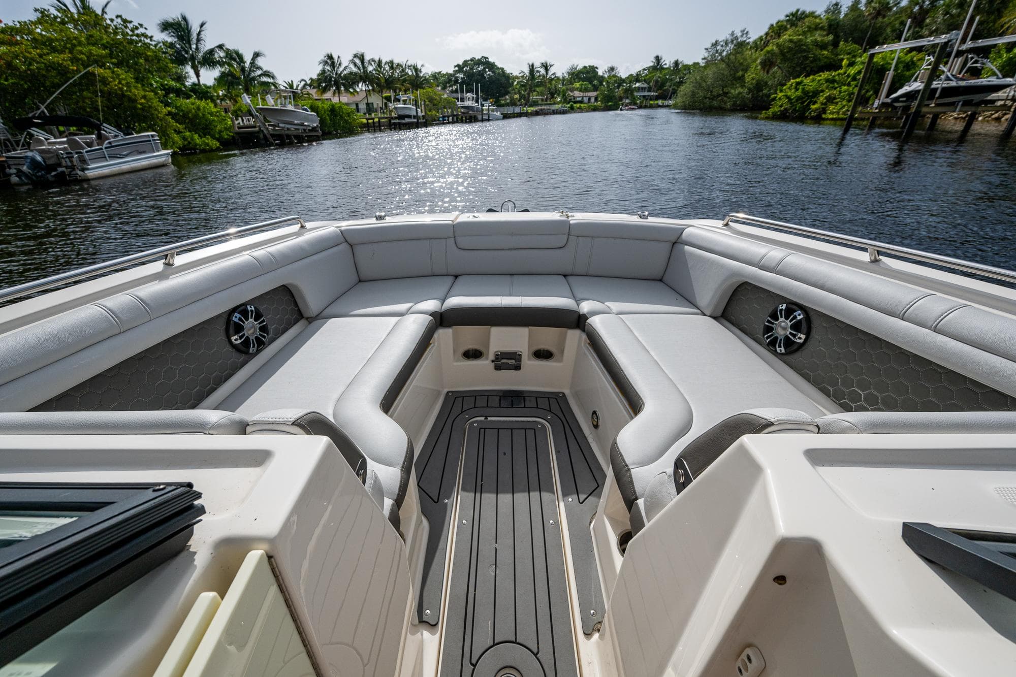 2022 Sea Ray SDX 290 boat interior with spacious seating on a calm river.