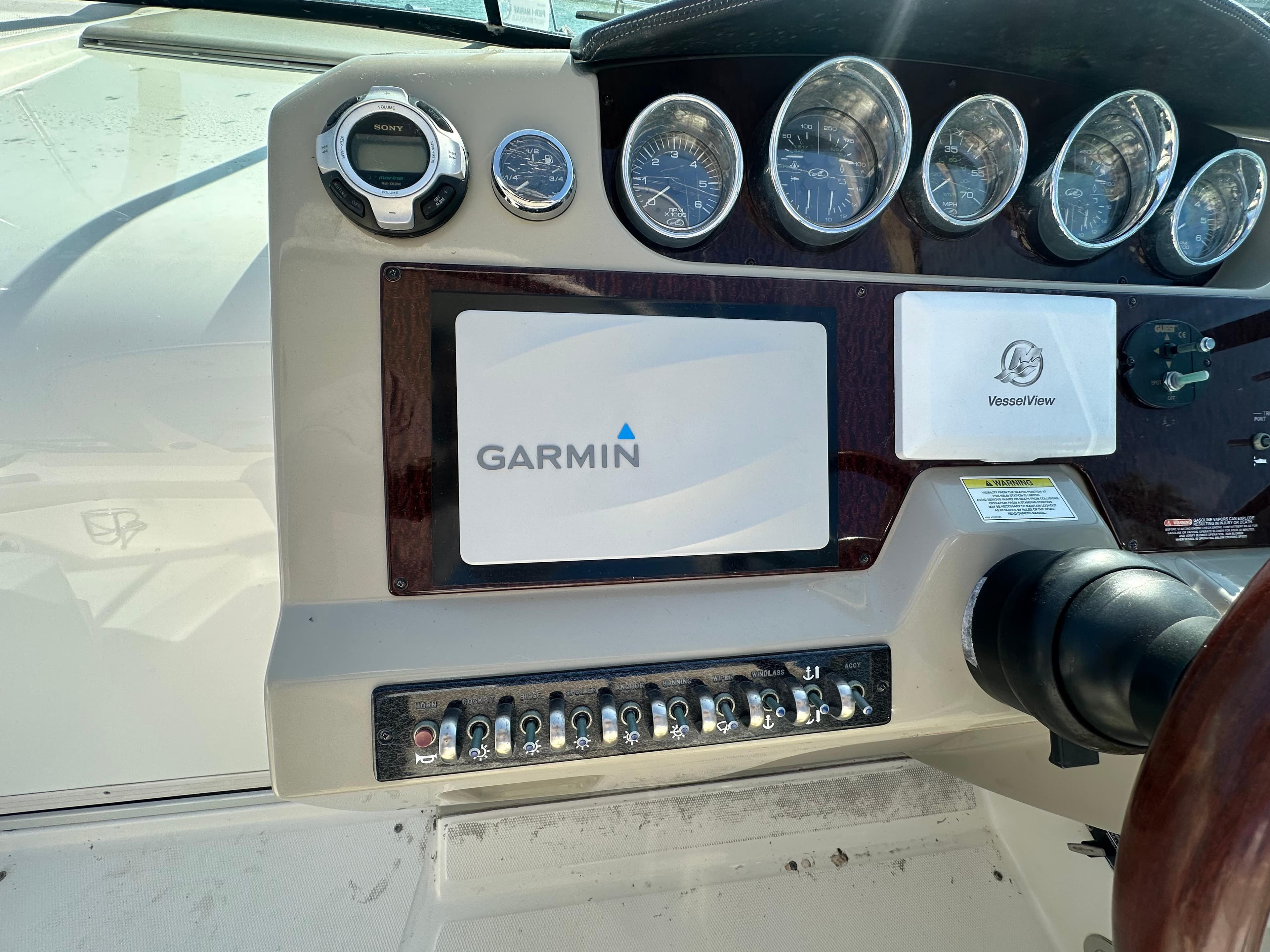 Control panel of 2013 Sea Ray 370 Venture with Garmin display and gauges.