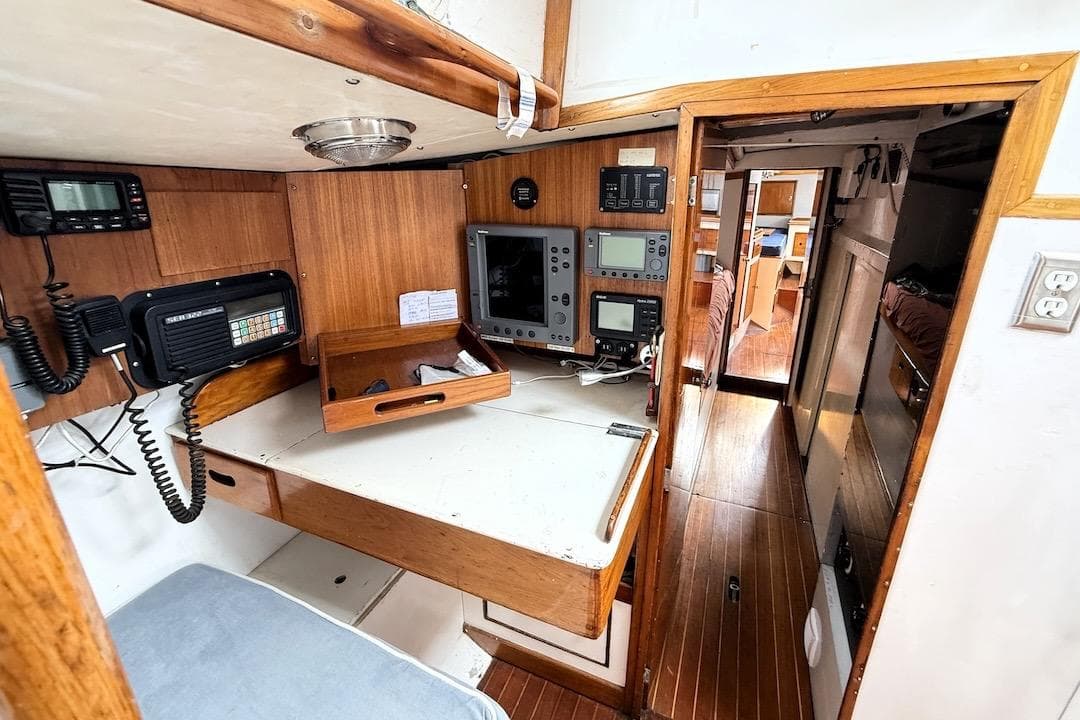 Interior of 1973 Sparkman & Stephens 55 Custom ketch with navigation equipment and wooden finish.