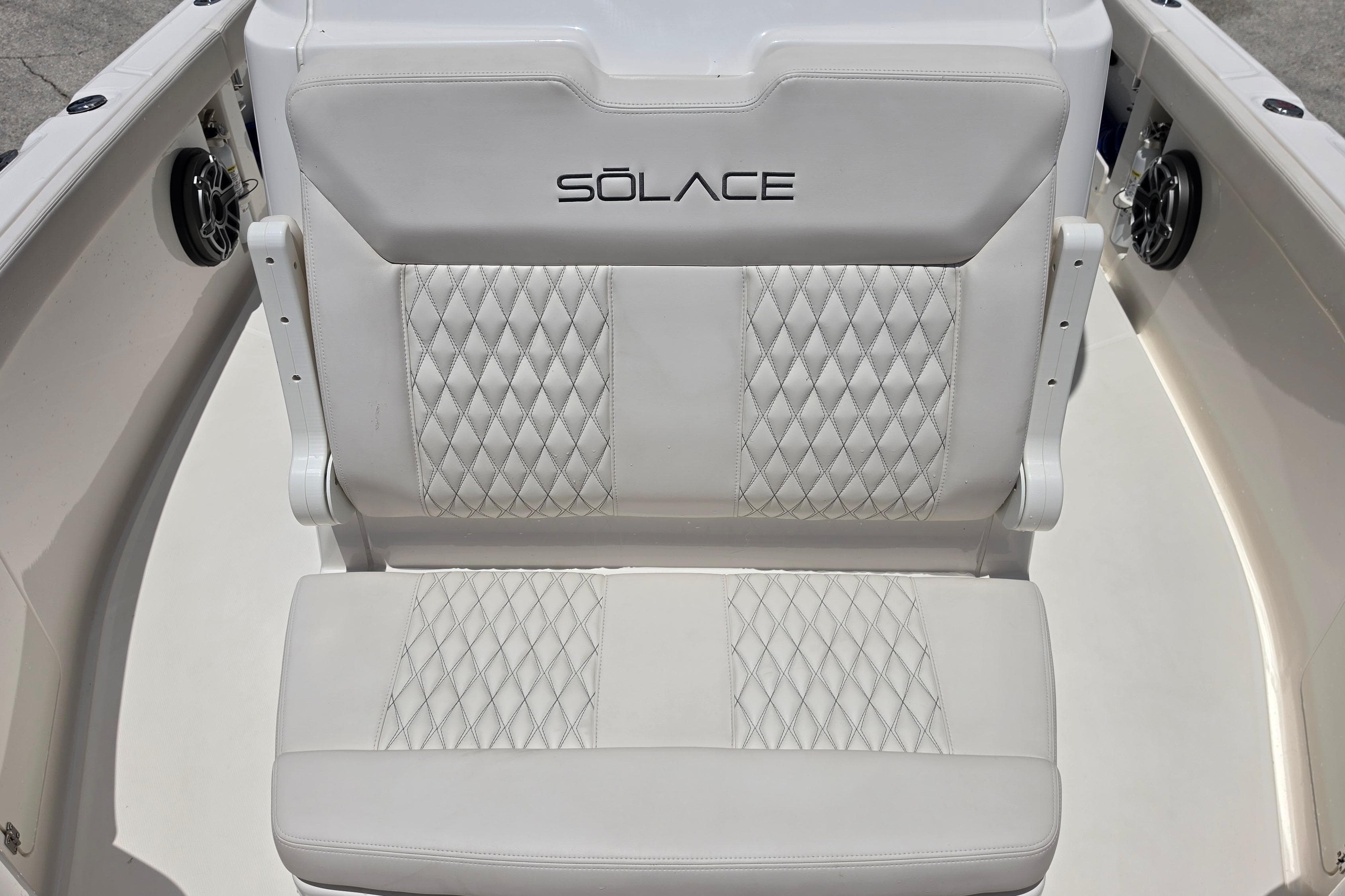 2026 Solace 28HCS boat seat with diamond-stitched white upholstery and logo.