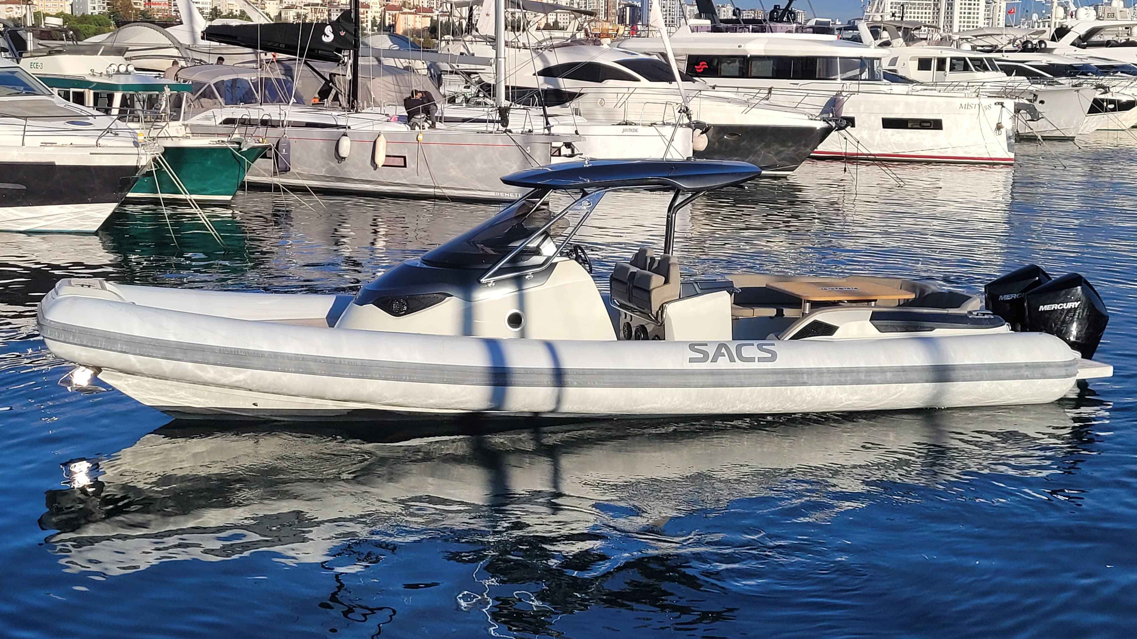 2022 SACS Strider 11 motorboat docked in harbor, modern design.