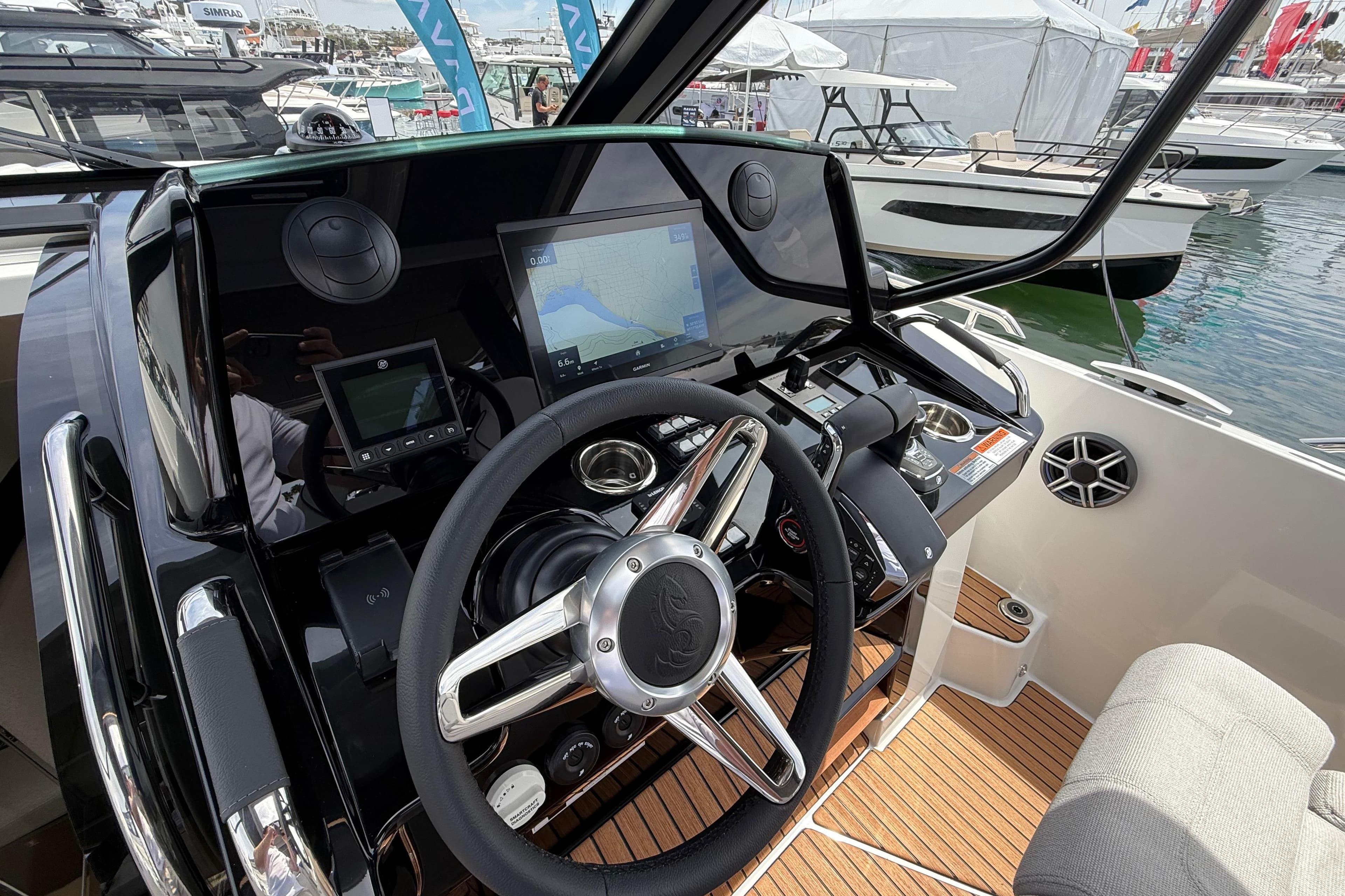 Helm of 2026 Beneteau Gran Turismo 35 with modern navigation equipment and steering wheel.