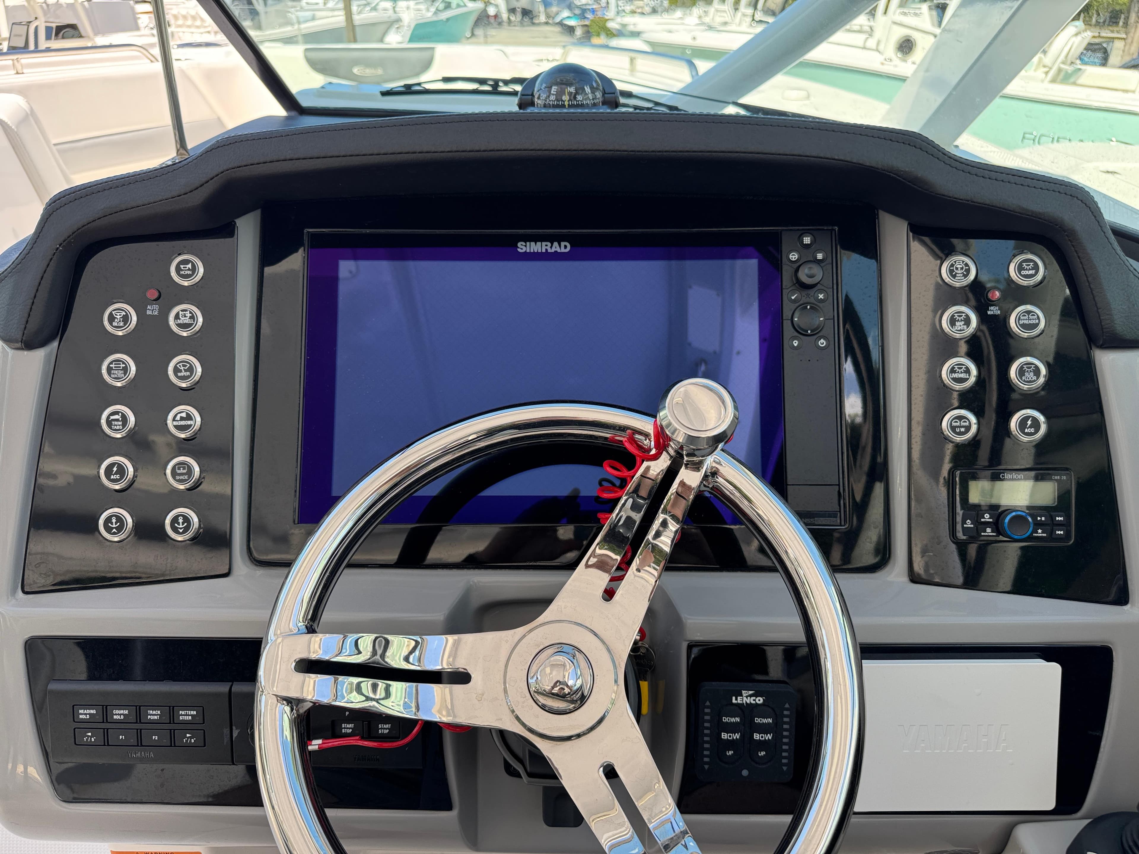 2024 Robalo R317 helm with Simrad display and modern controls.