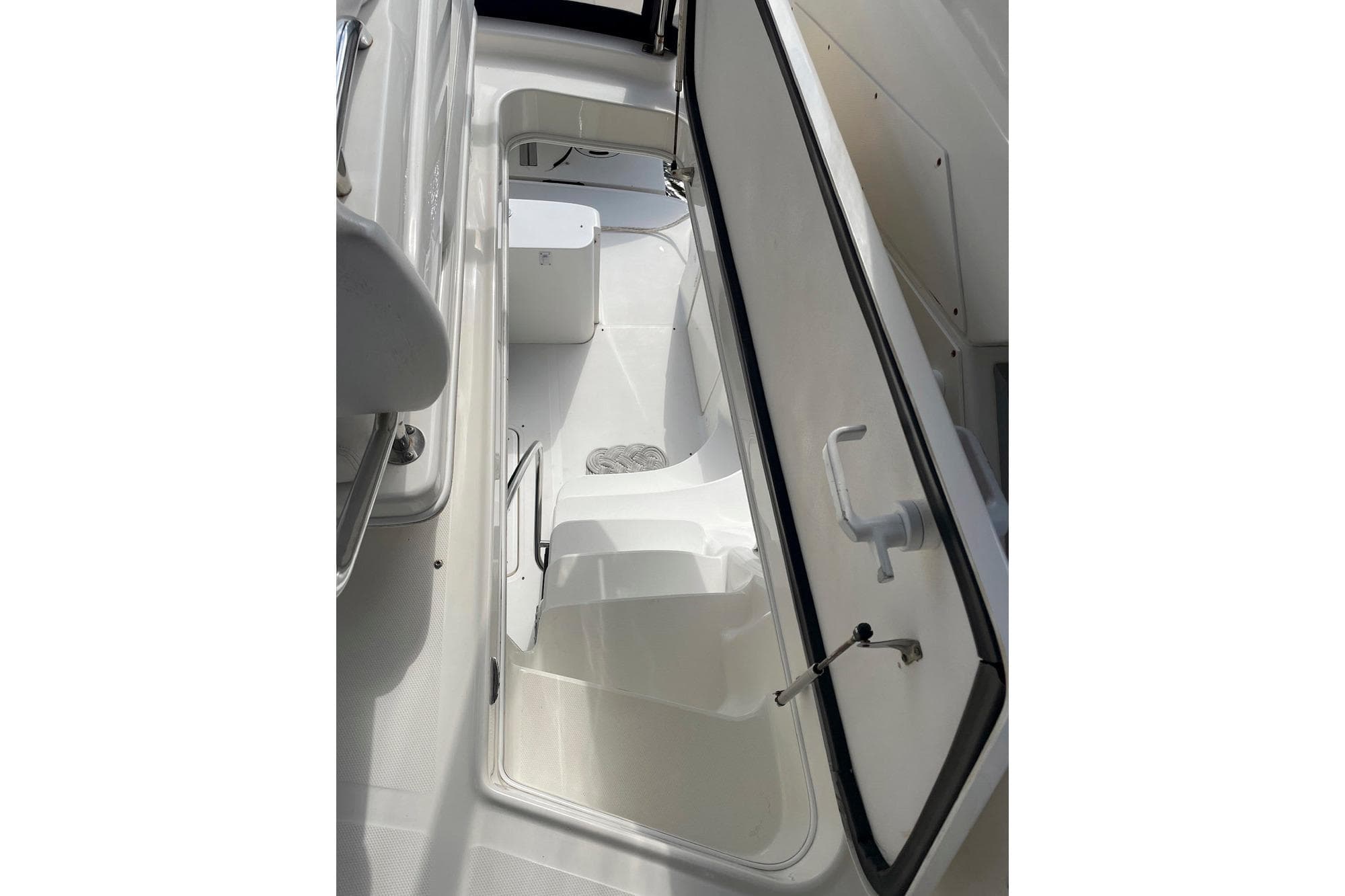 2007 Sea Ray 44 Sedan Bridge storage compartment with open hatch, showcasing interior space.