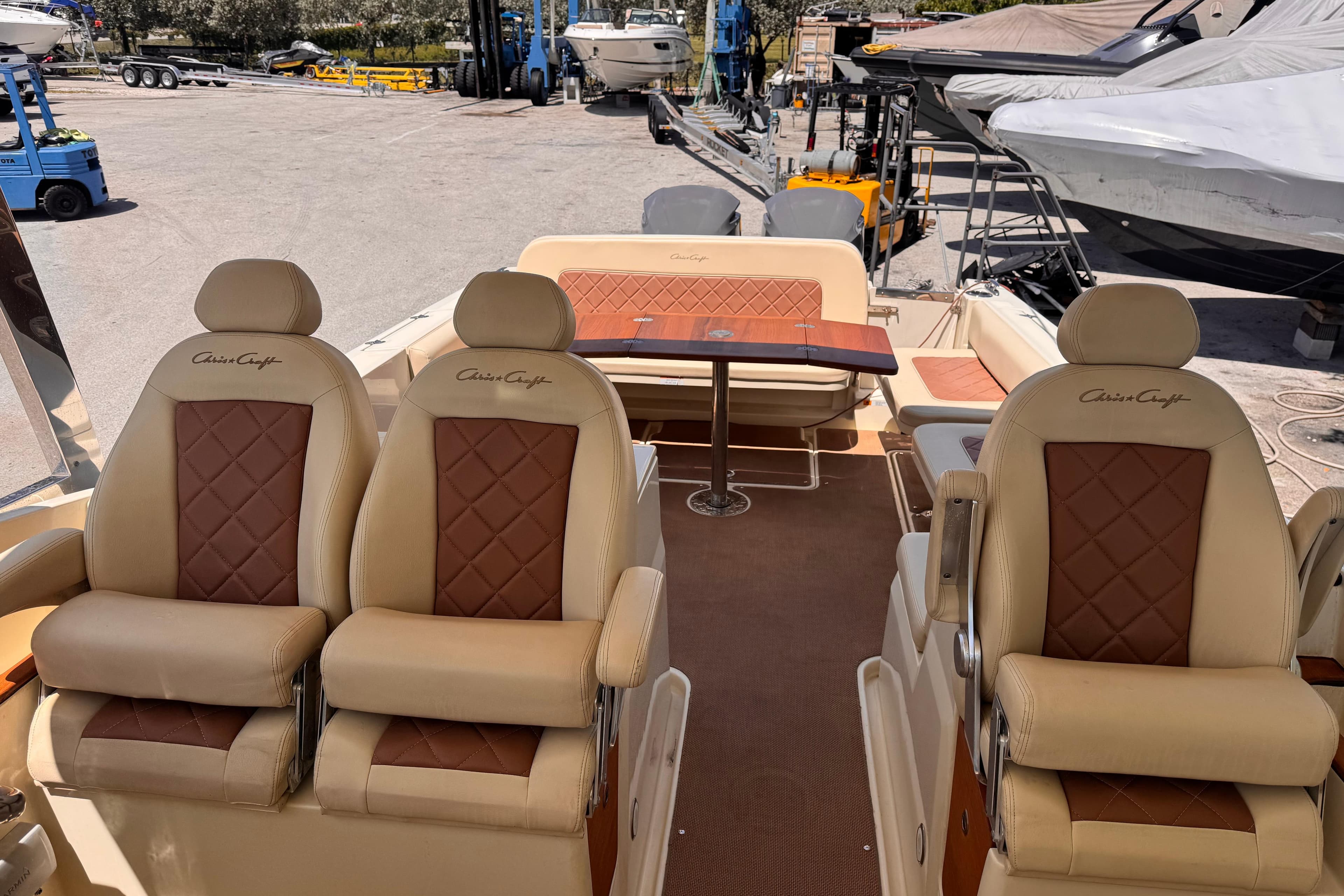 2018 Chris-Craft Calypso 30 boat interior with luxurious seating and table.