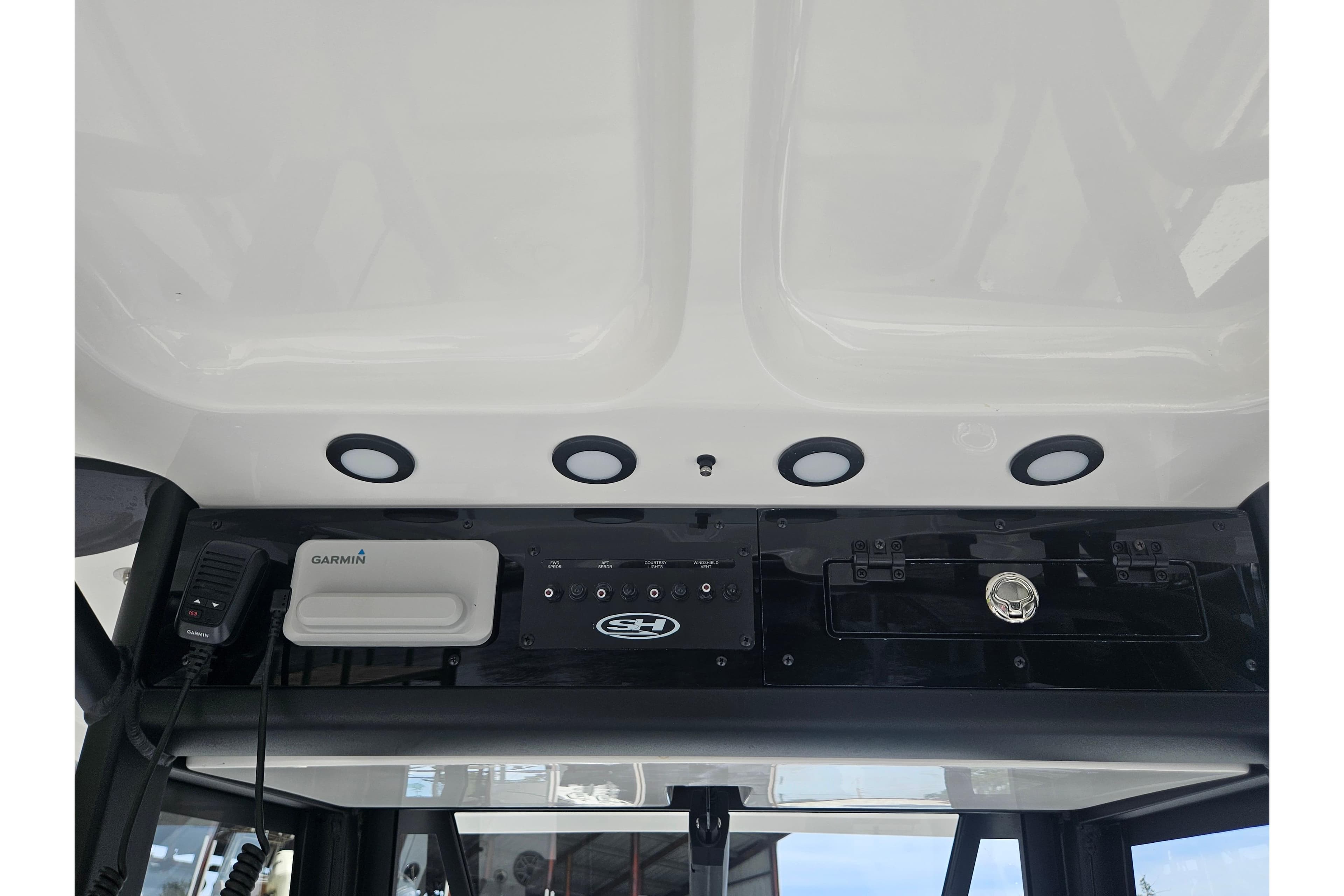 2025 Sea Hunt Gamefish 27 console with Garmin electronics and overhead lighting.