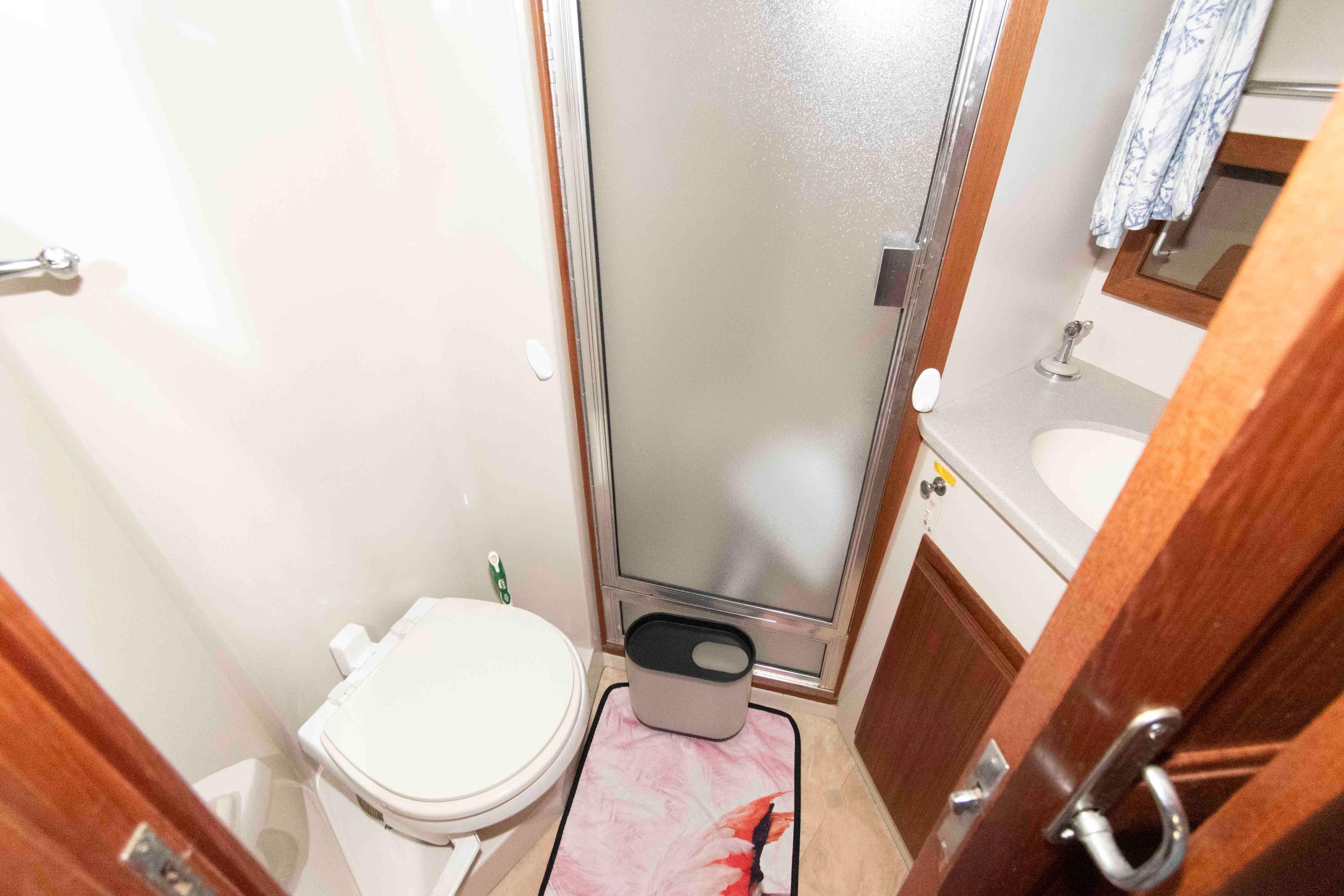 Bathroom interior of 1990 Californian 45 Motor Yacht with shower and toilet.