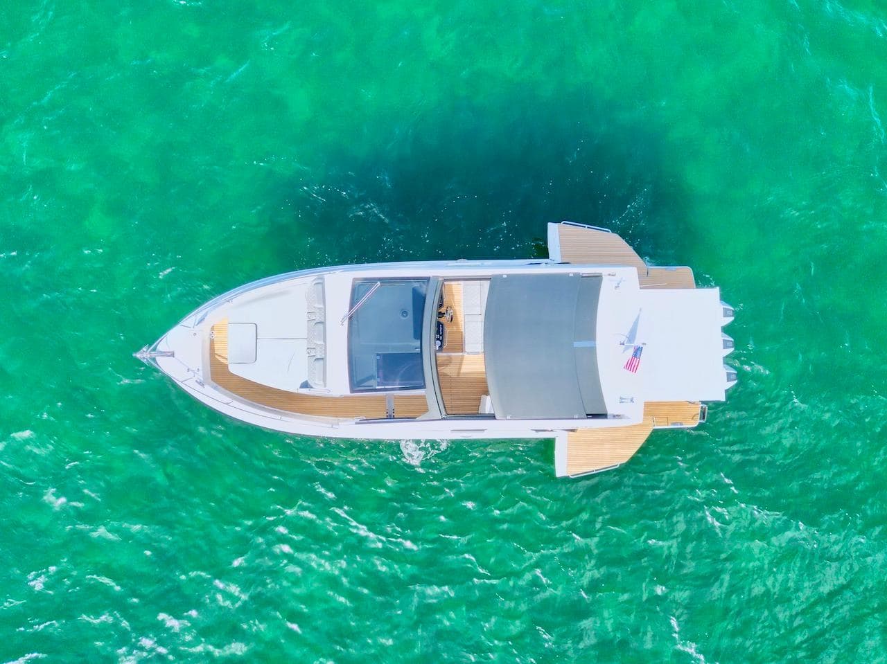 Aerial view of Schaefer 380 yacht on turquoise water, year 2027.