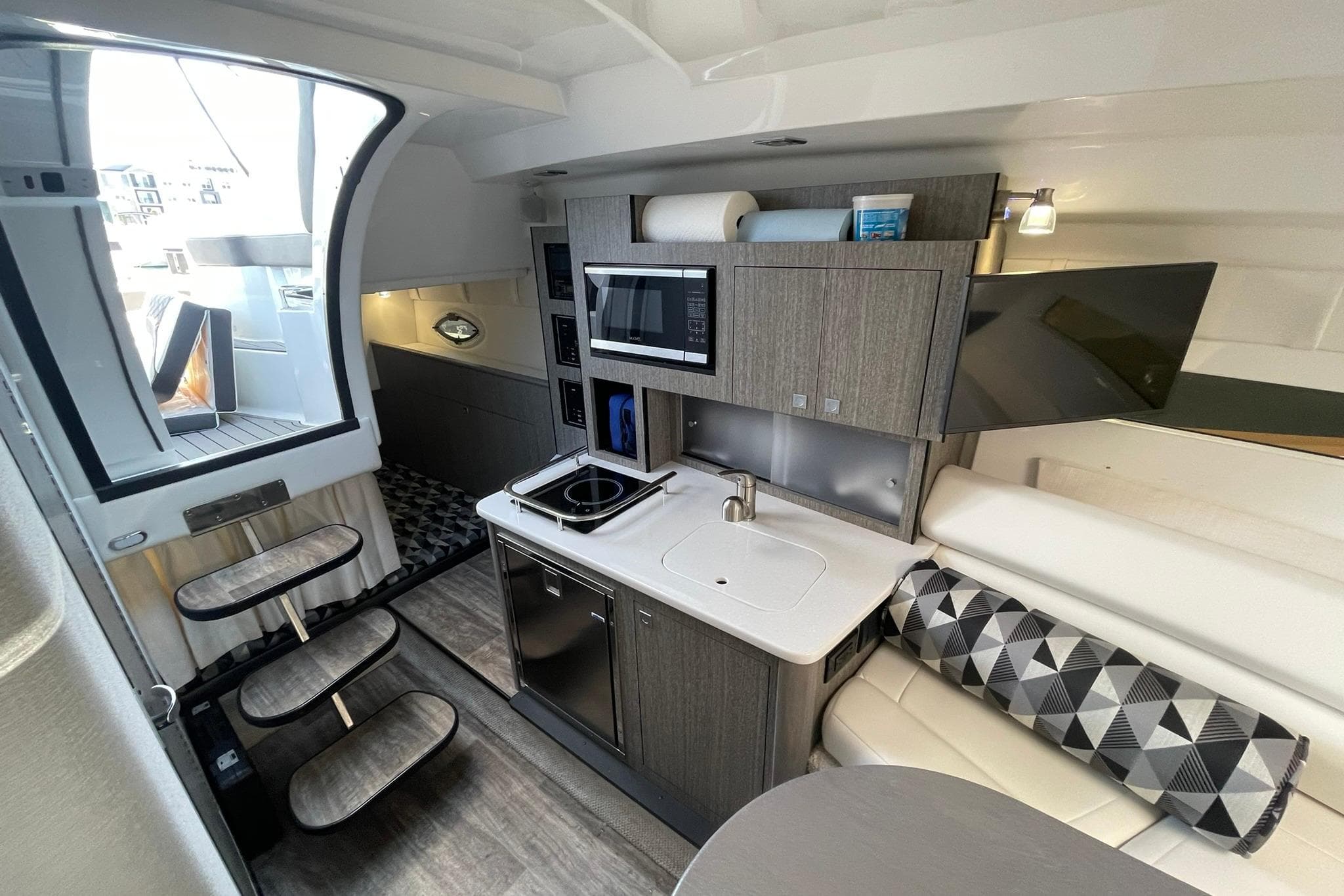 GALLEY OVERVIEW LOOKING AFT TO CABIN ENTRANCEWAY W/FLOATING STEPS, & AFT CABIN