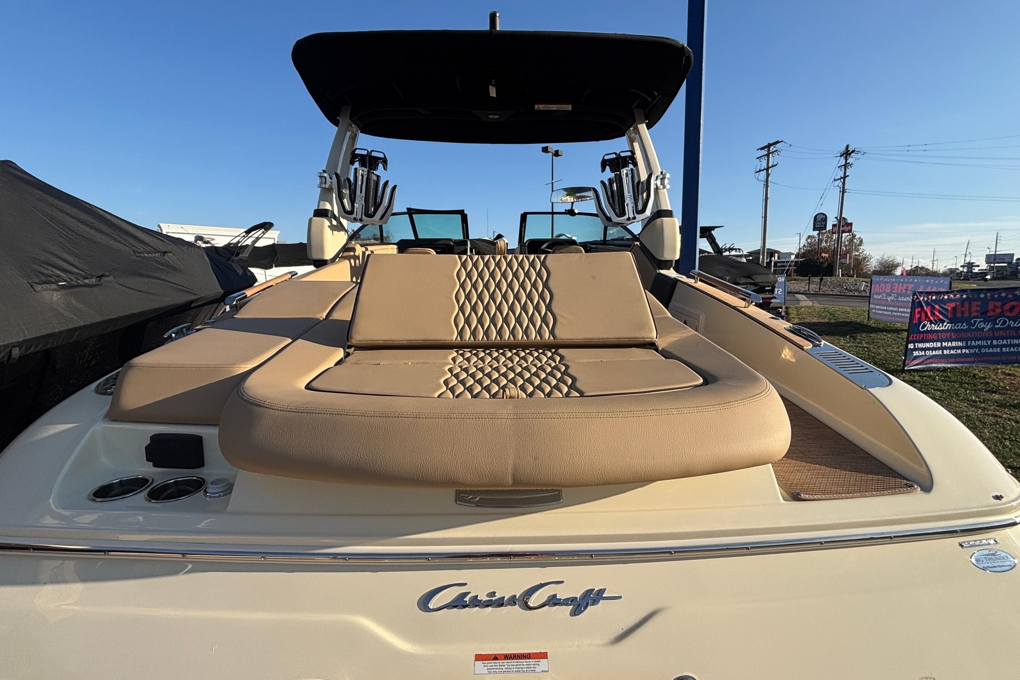 2026 Chris-Craft Sportster 28 boat with luxurious seating and sleek design.