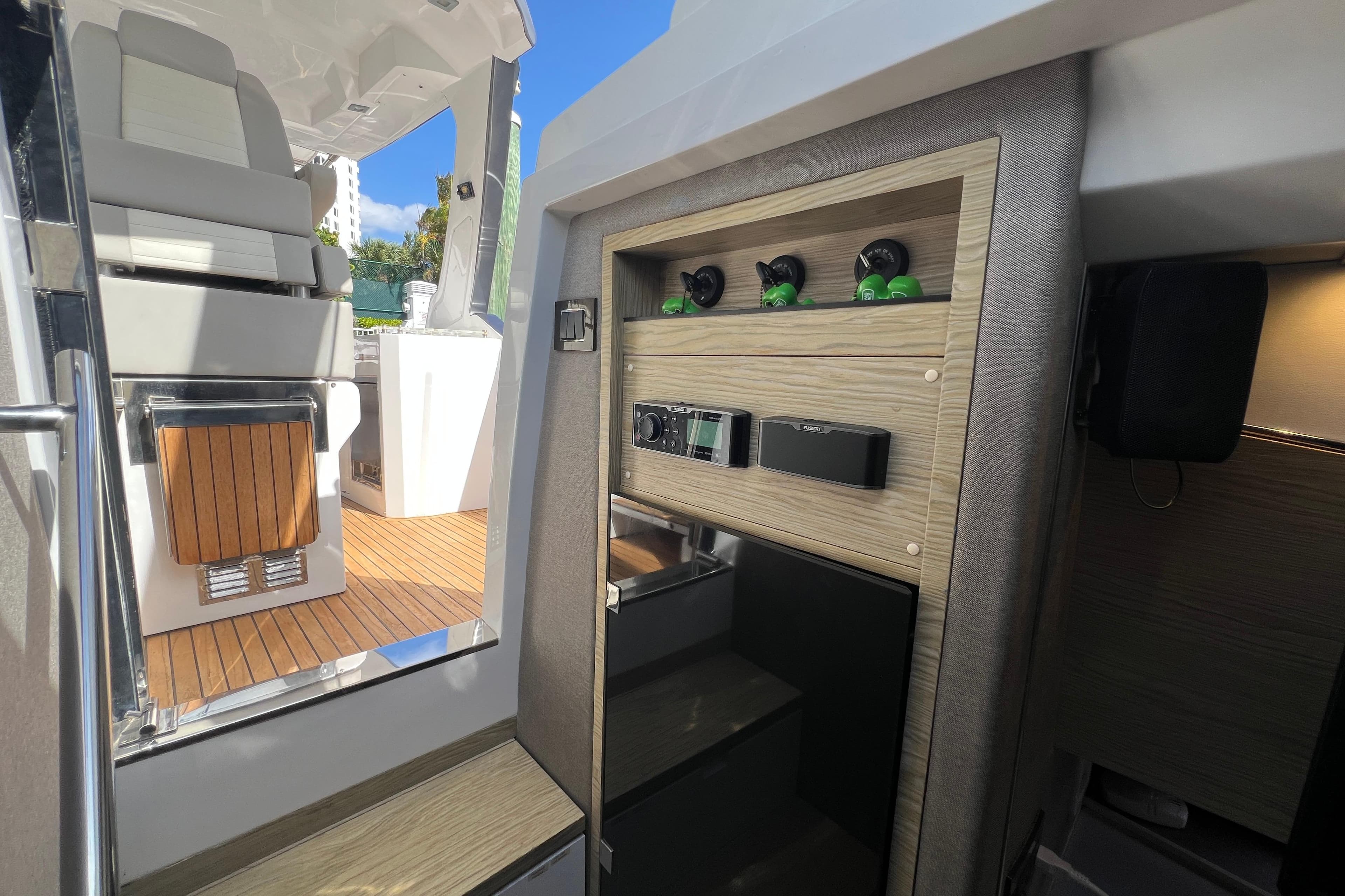 Interior view of 2018 Azimut Verve 40 yacht, featuring modern seating and wooden accents.