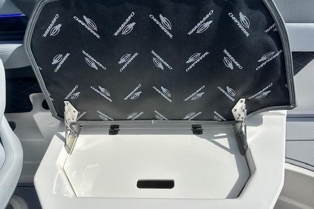 2026 Chaparral 6 SSX boat storage compartment with branded interior lining.