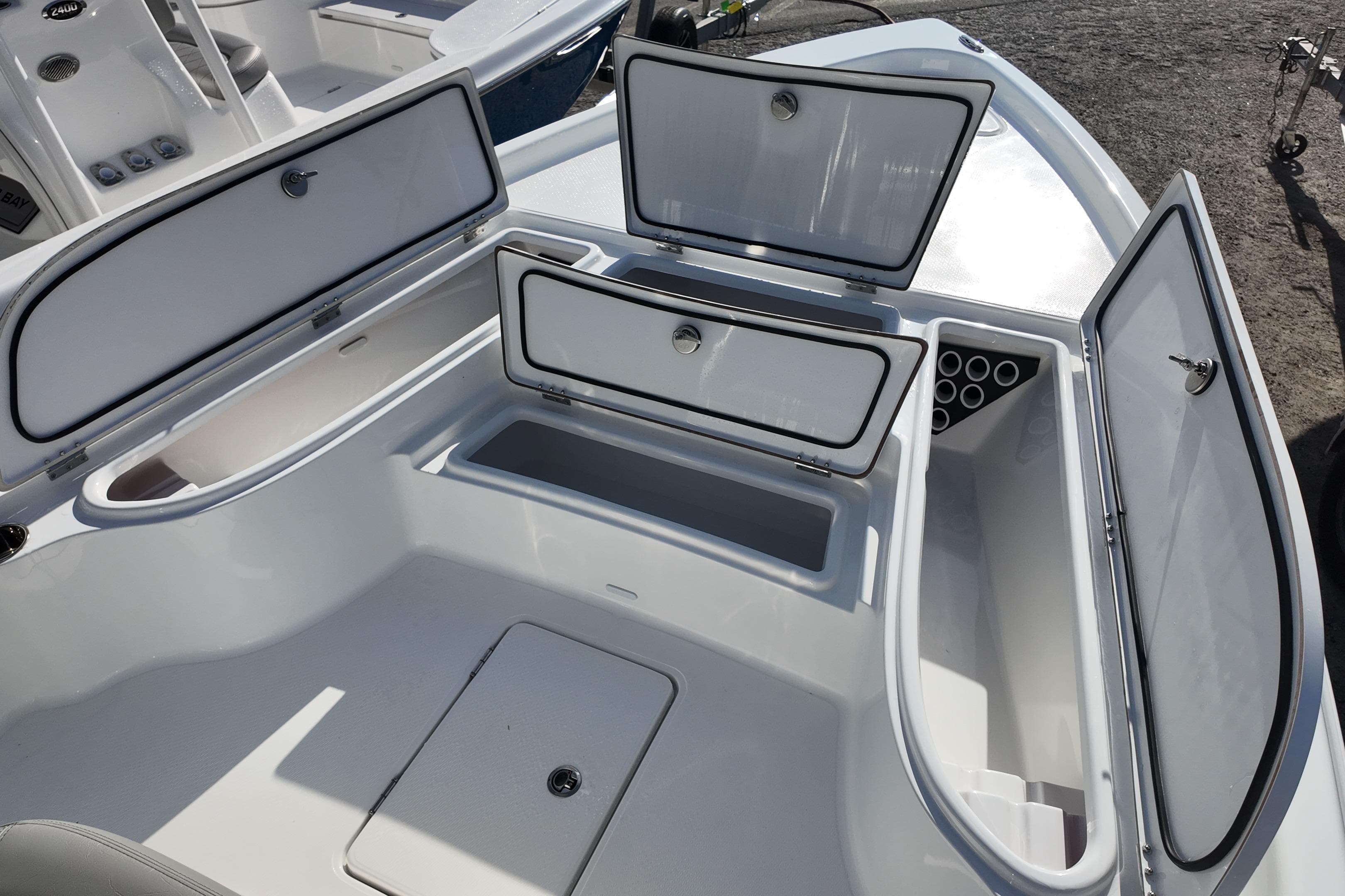 2026 Blazer PureBay 2400 boat storage compartments open, showcasing spacious interior design.