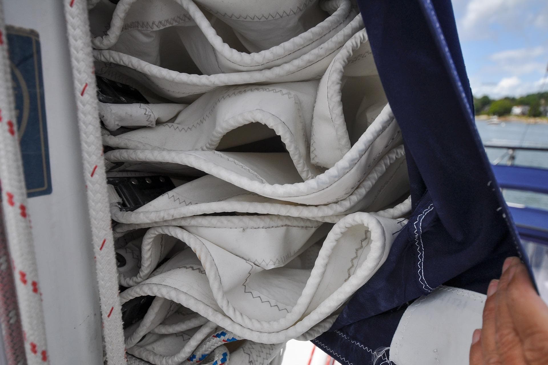 Folded sail on a 1993 Catalina 42 yacht, neatly stored in a sail cover.
