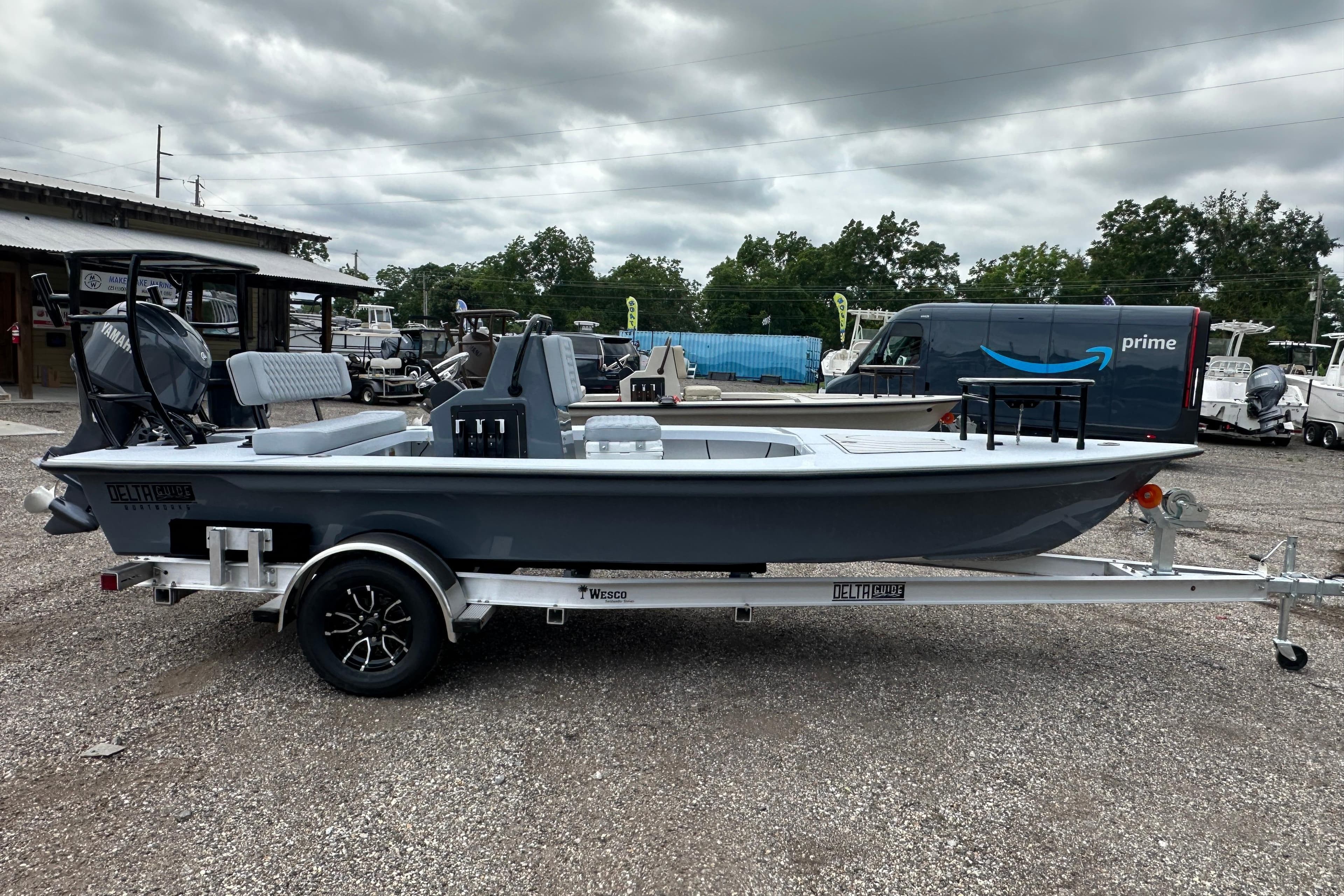 2027 Delta Boatworks Delta D18 on trailer, parked outdoors under cloudy sky.