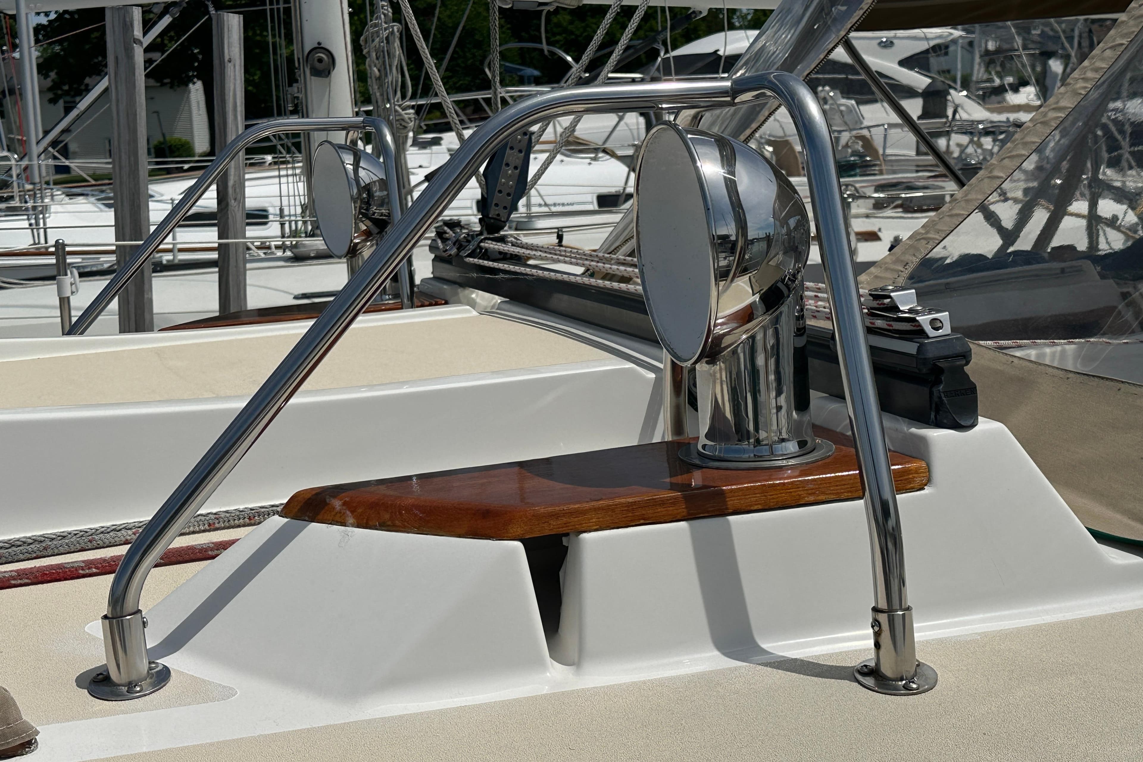 Close-up of a 1999 Tartan 4100 sailboat deck with polished metal fittings.