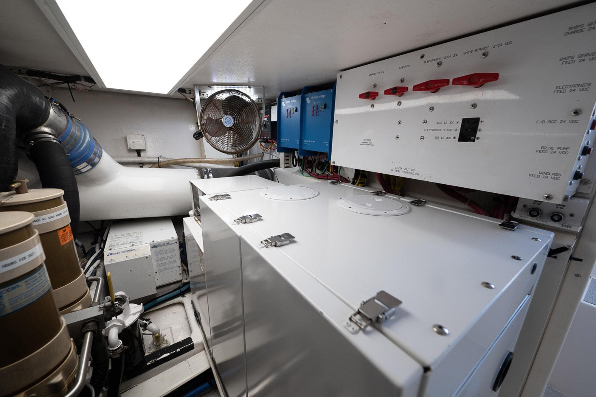 Engine room of 2003 Viking 48 Convertible yacht with electrical panels and ventilation system.