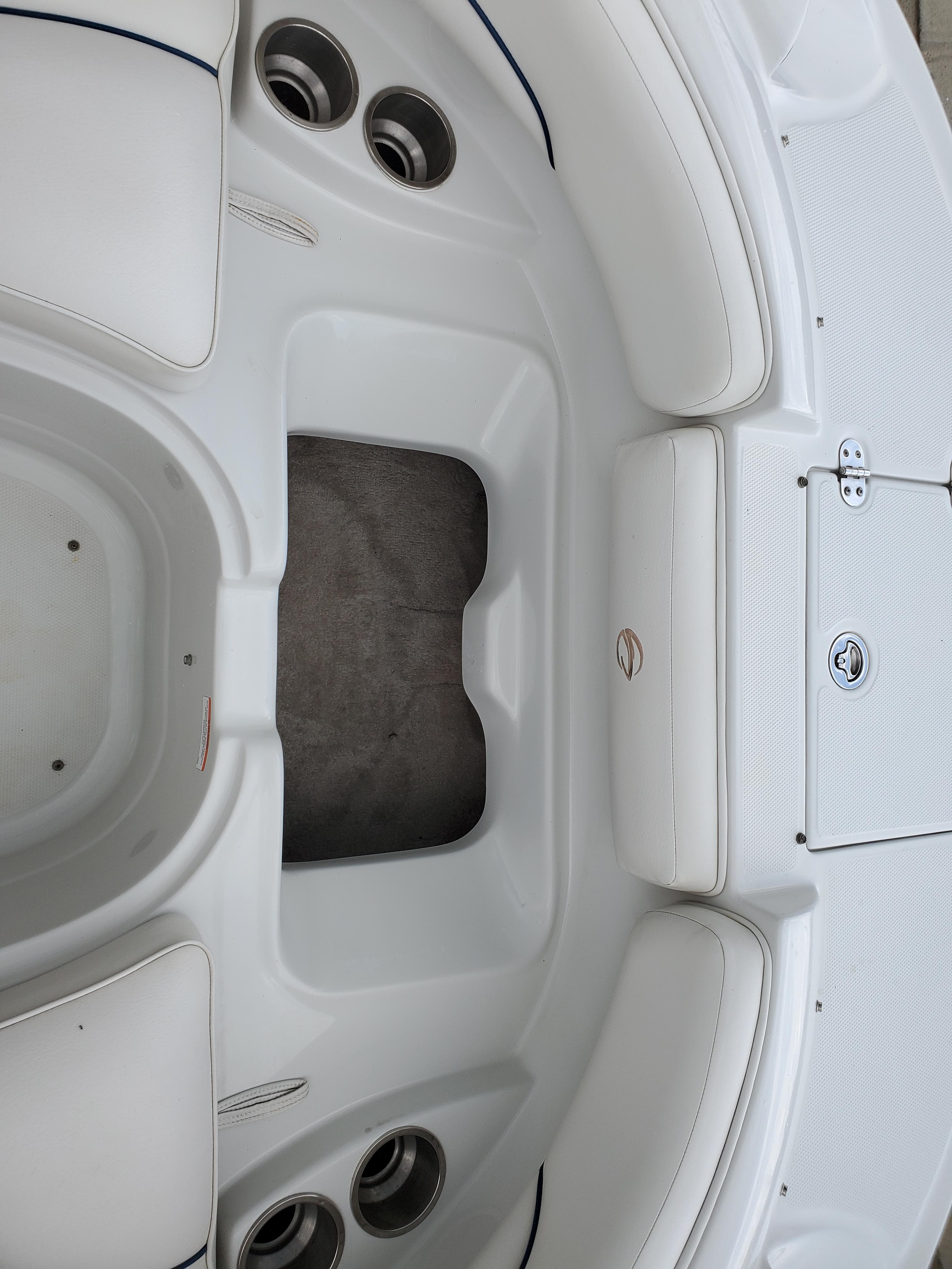2007 Crownline 220EX boat interior with white seating and cup holders.