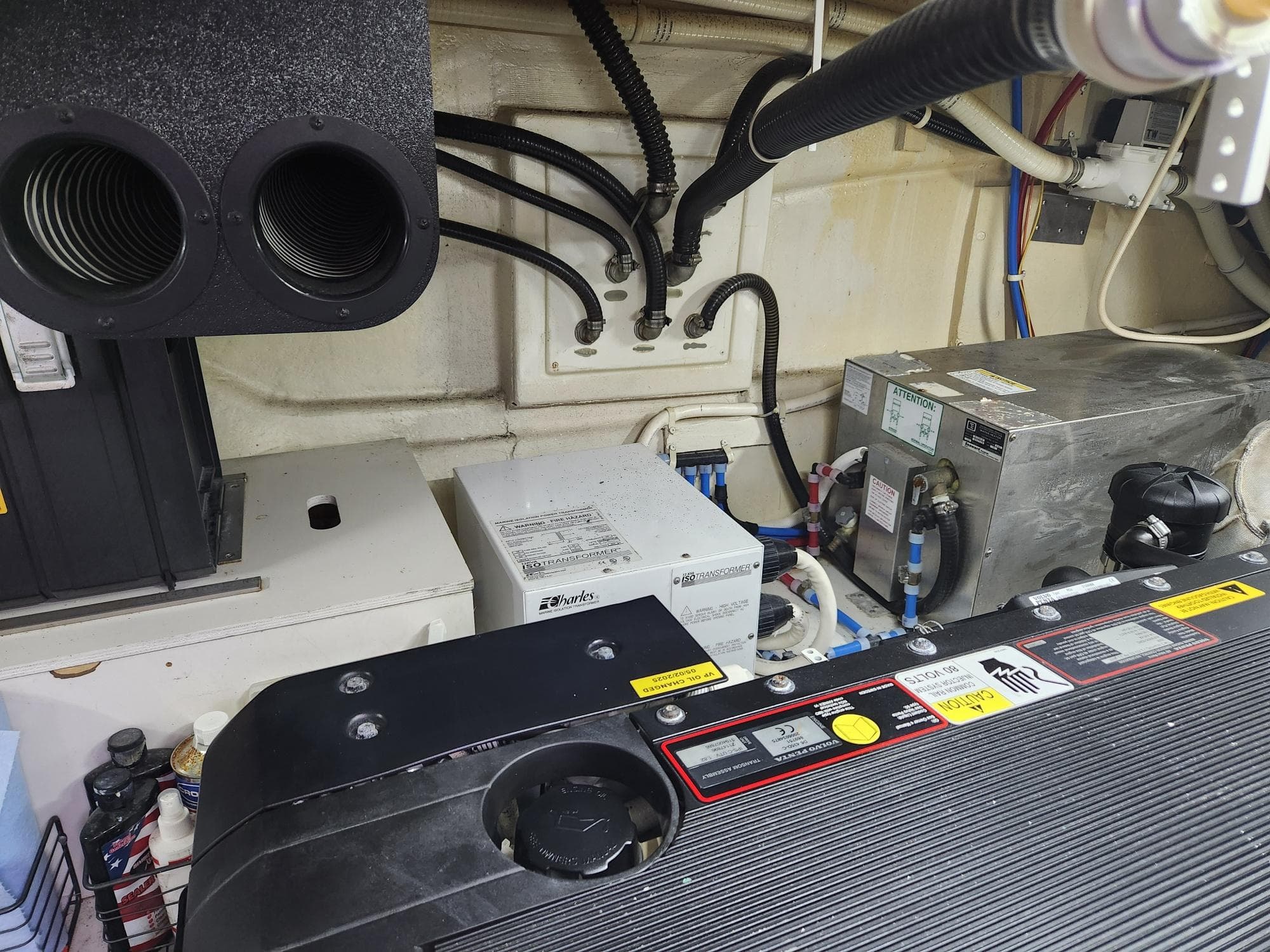 Engine room of a 2010 Marquis 500 SC yacht, featuring various mechanical components.
