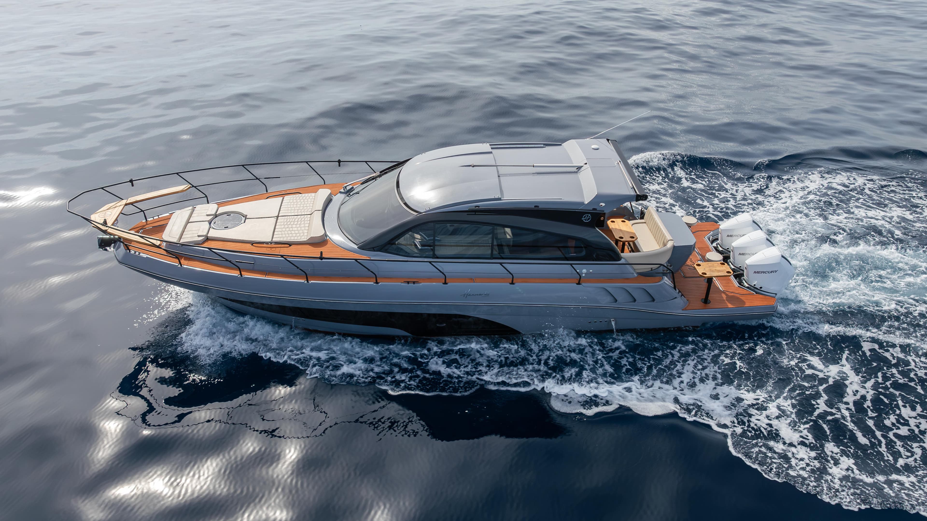 Luxurious 2025 Hanover 415 yacht cruising on open water.